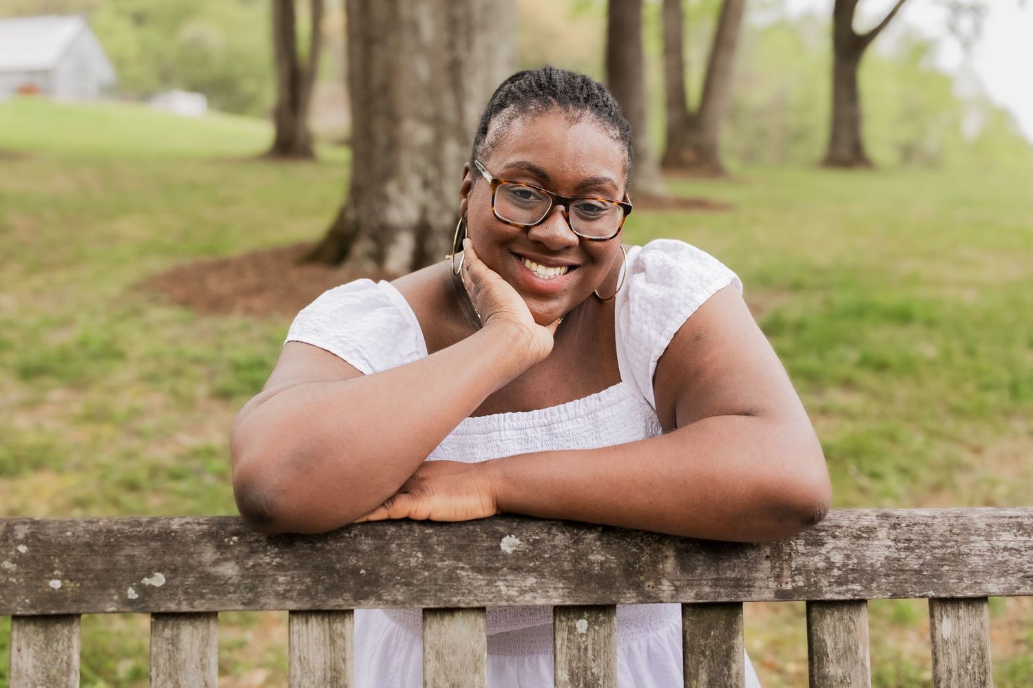 young girl smiling for graduation photos in vienna virginia