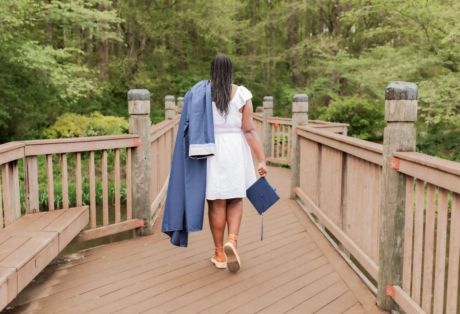 young girl smiling for graduation photos in vienna virginia
