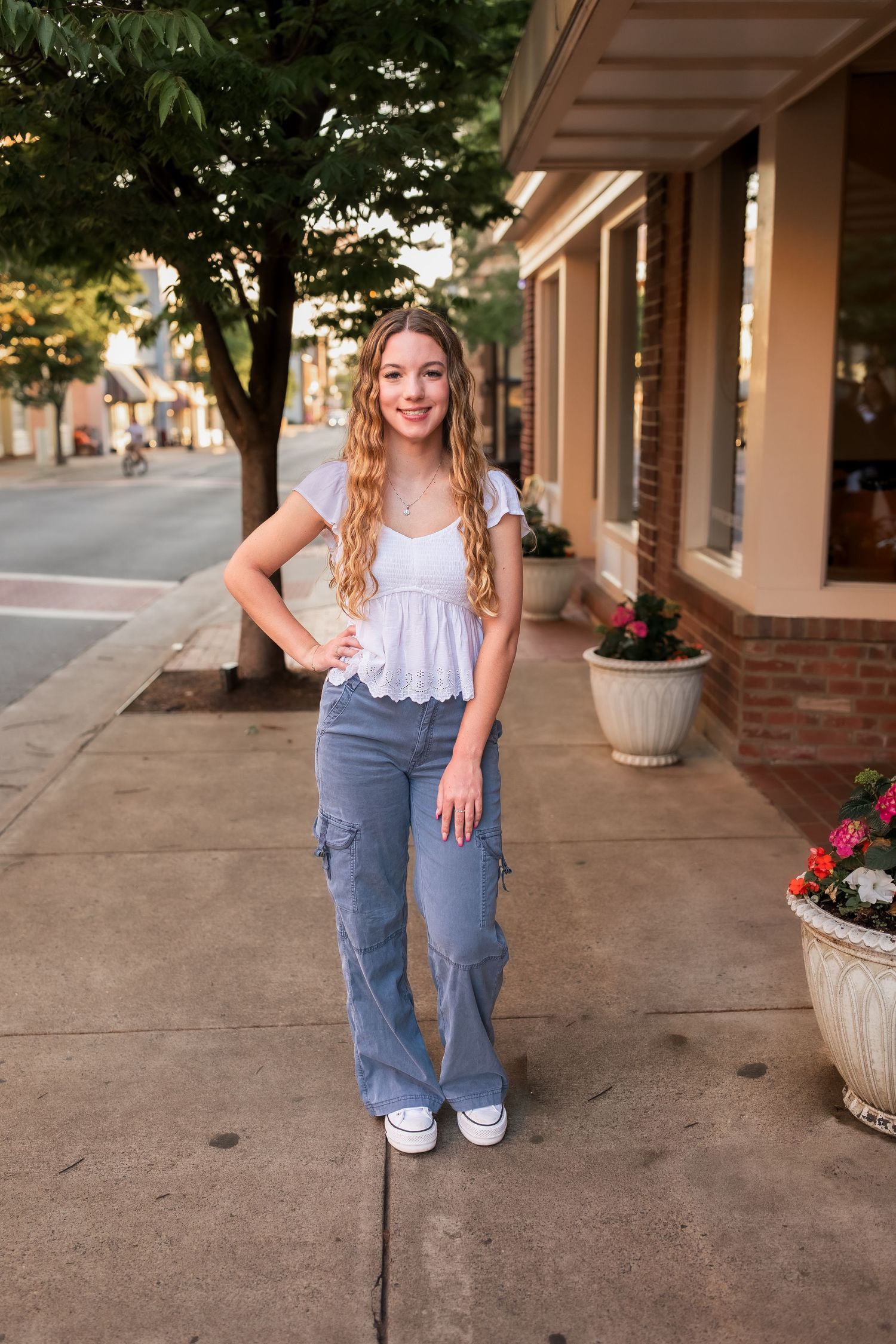 young girl smiling for graduation photos in vienna virginia