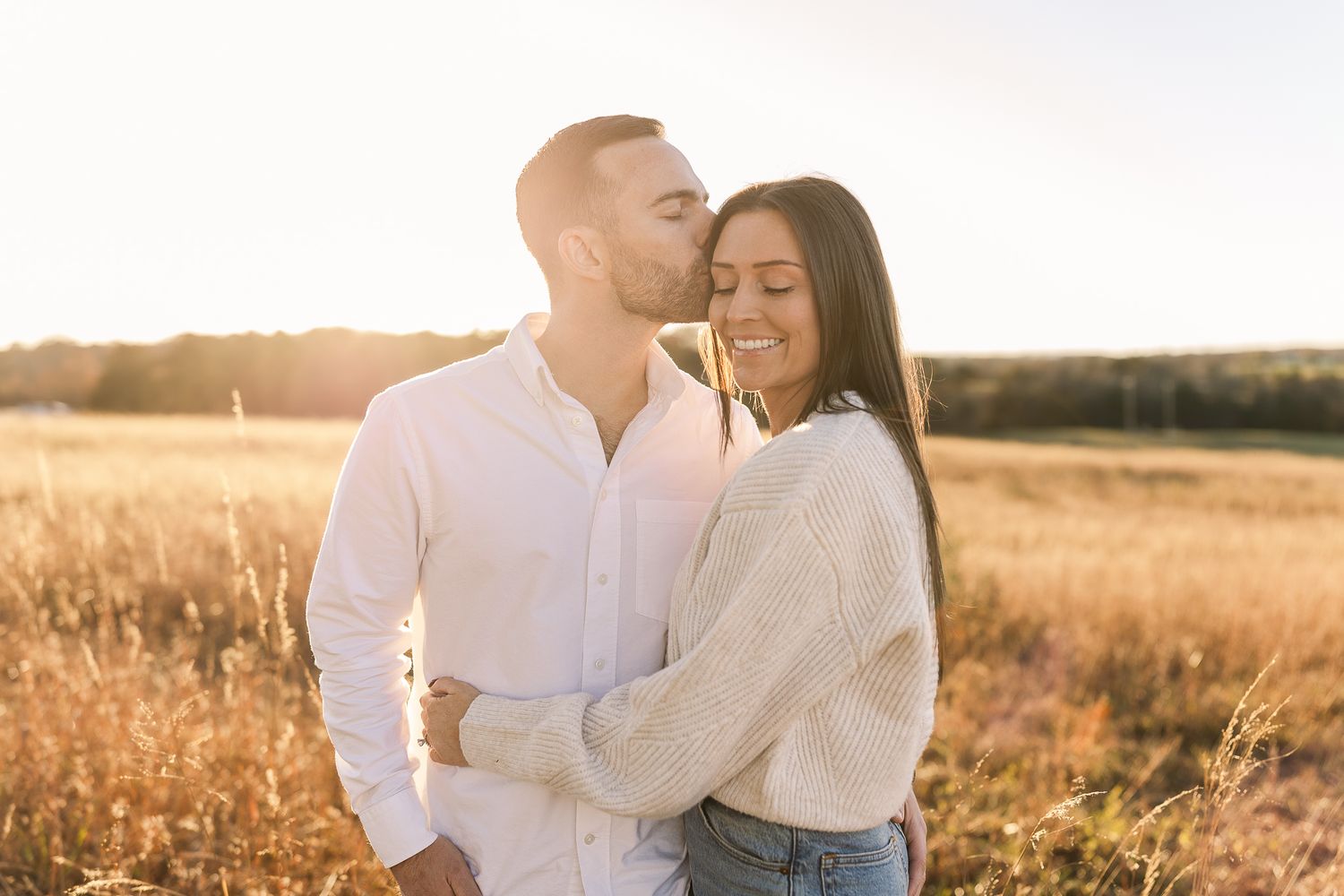 a young couple smiling together during sunset in manassas virginia