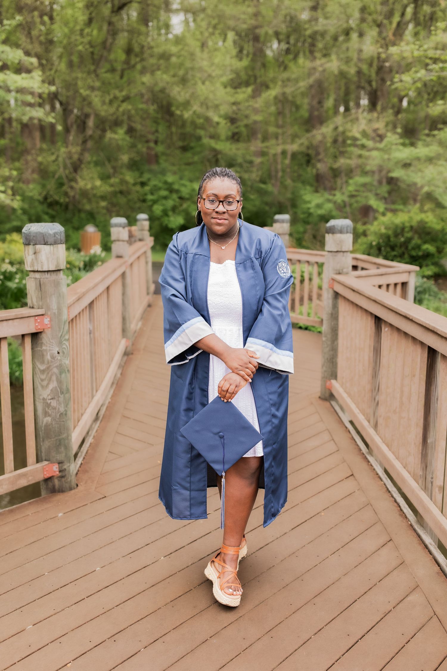 young girl smiling for graduation photos in vienna virginia