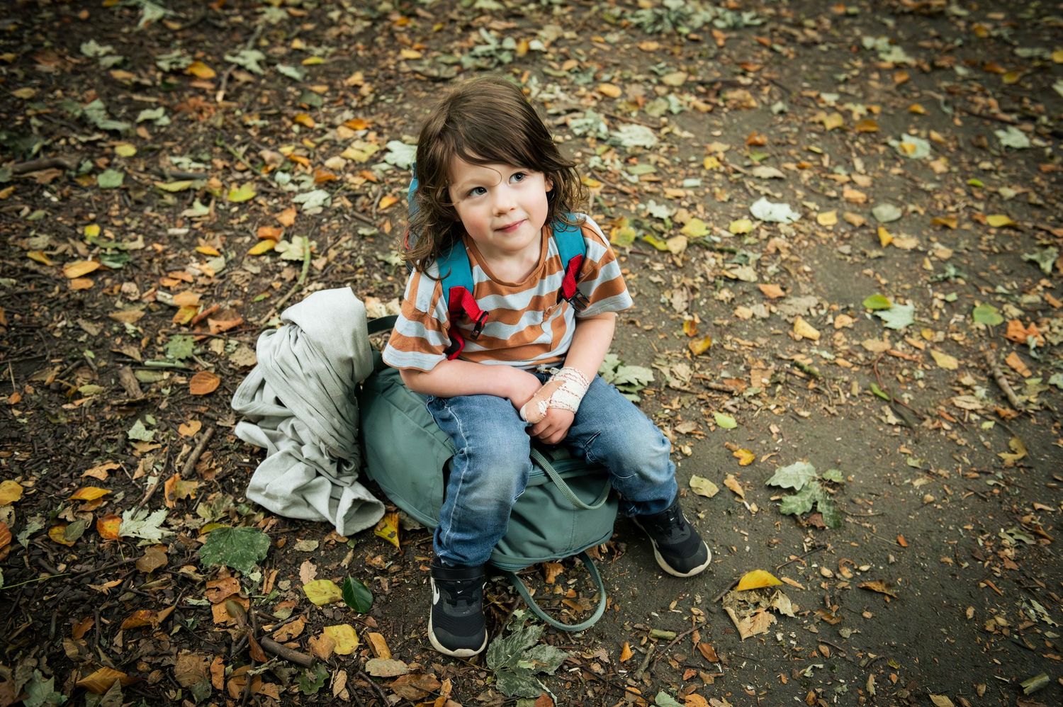 An autumnal photo of a boy during a family photoshoot in Leeds, Yorkshire.