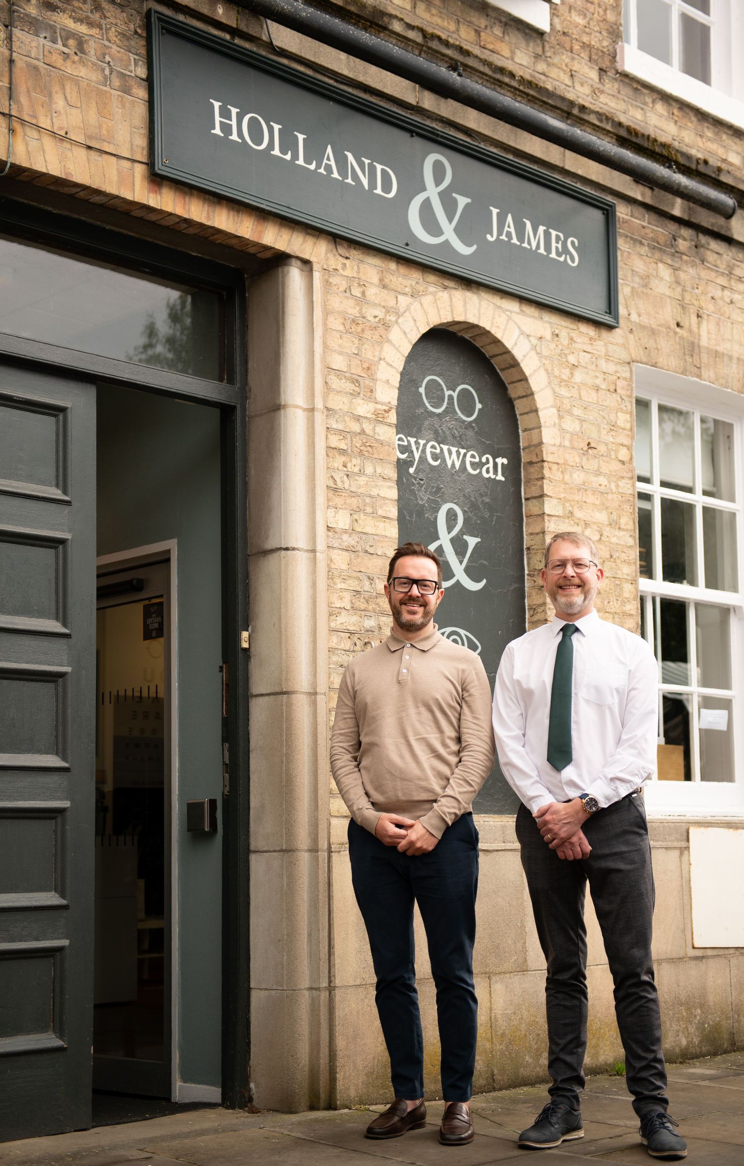 Exterior of Holland & James eyewear store with stone facade and signage - business photos in Brigg, North Lincolnshire.