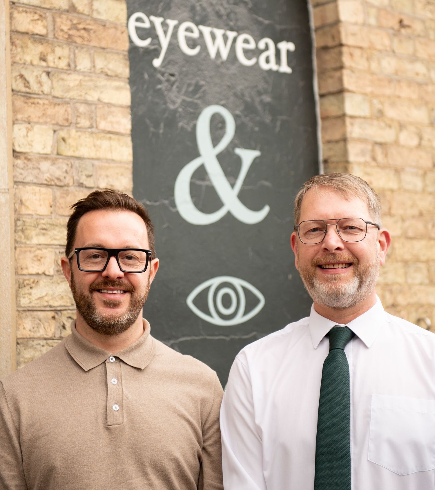 Professional business owners in front of their optometrist shop. Headshots taken in Brigg, North Lincolnshire.