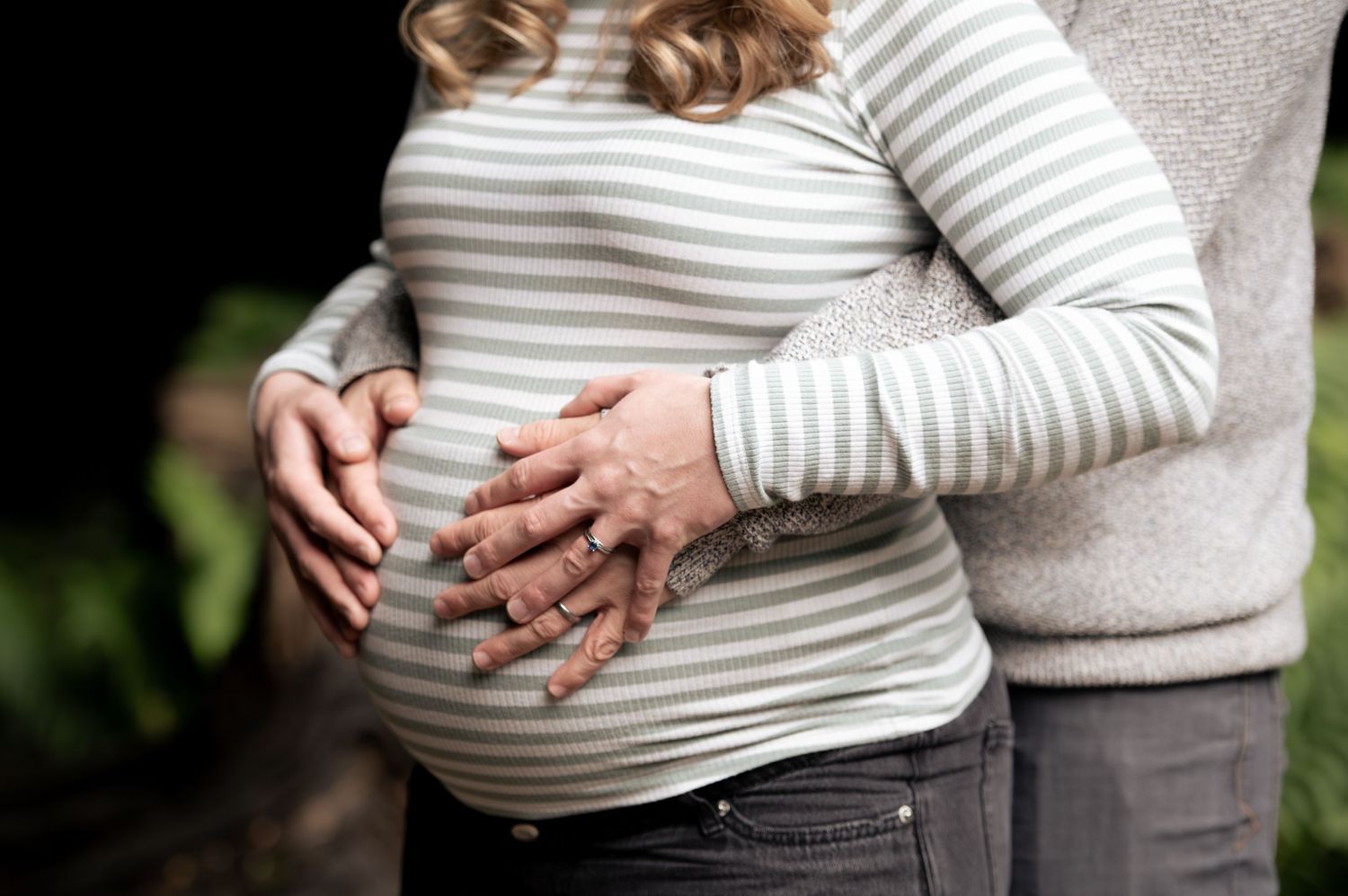 A close up of a pregnancy bump during a natural documentary-style maternity shoot in Leeds.