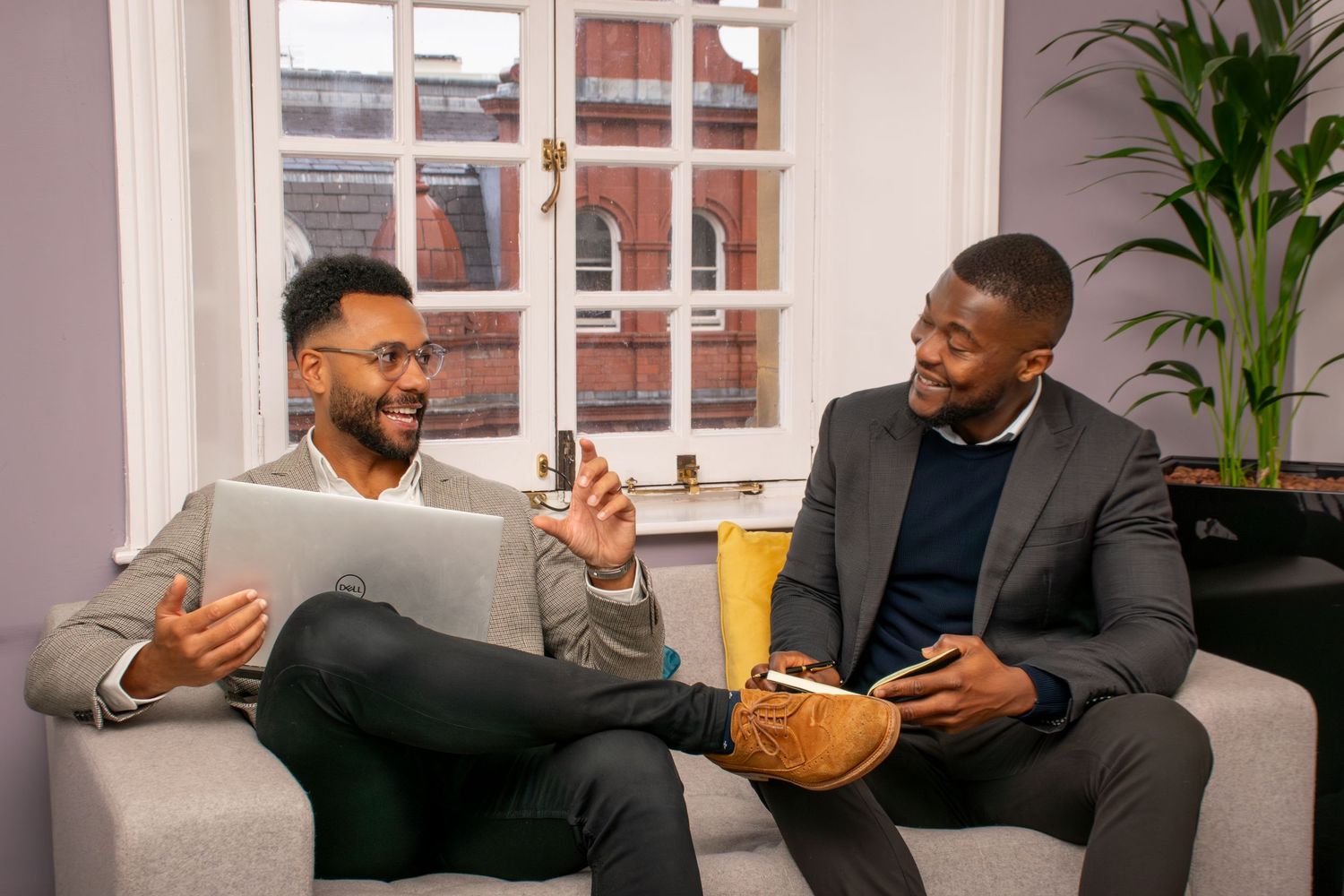 A professional conversation shot in a modern Leeds office setting, for a recruitment business.