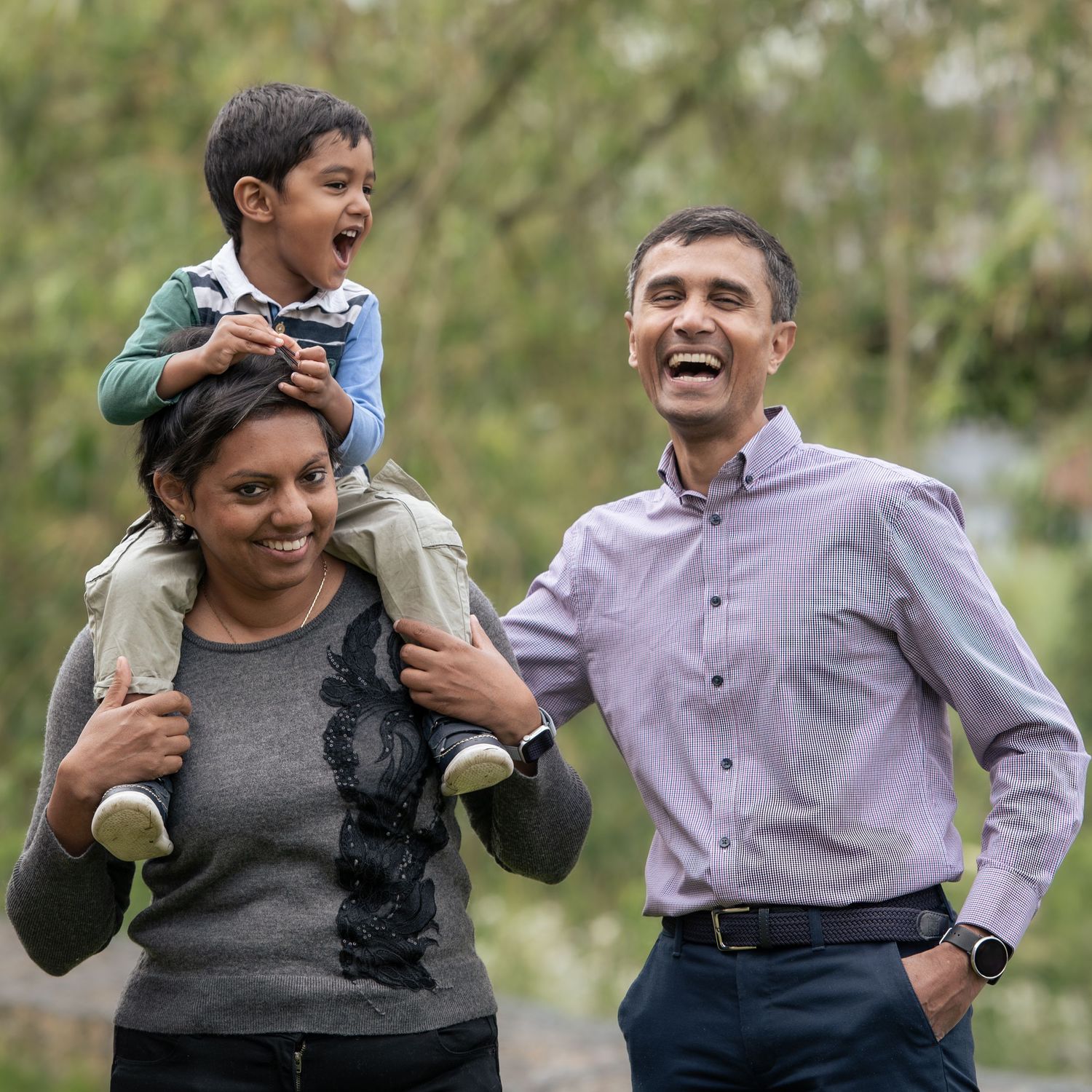 A mother, father, and son, during an outdoor family photoshoot in Leeds.