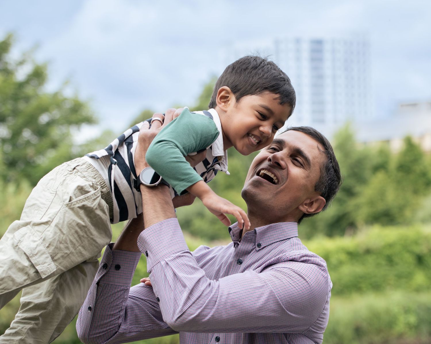 An exciting whirl in the air between father and son, captured on a bright day in Leeds.
