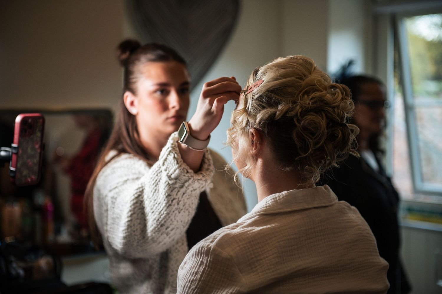 Intimate indoor wedding preparation moments captured in soft lighting, at Lodge Farm Weddings, Yorkshire.
