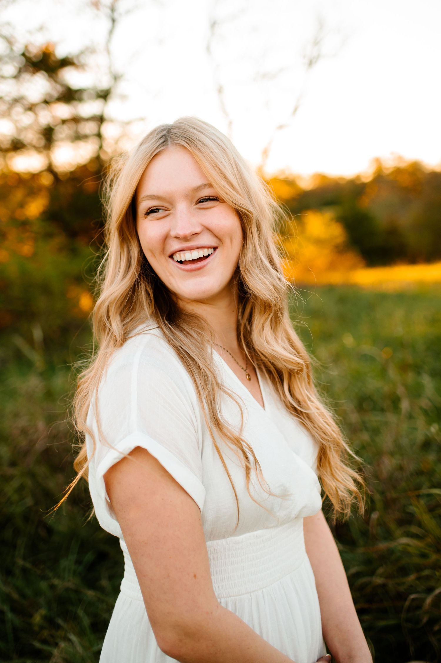 Natural outdoor portrait with warm sunset lighting.