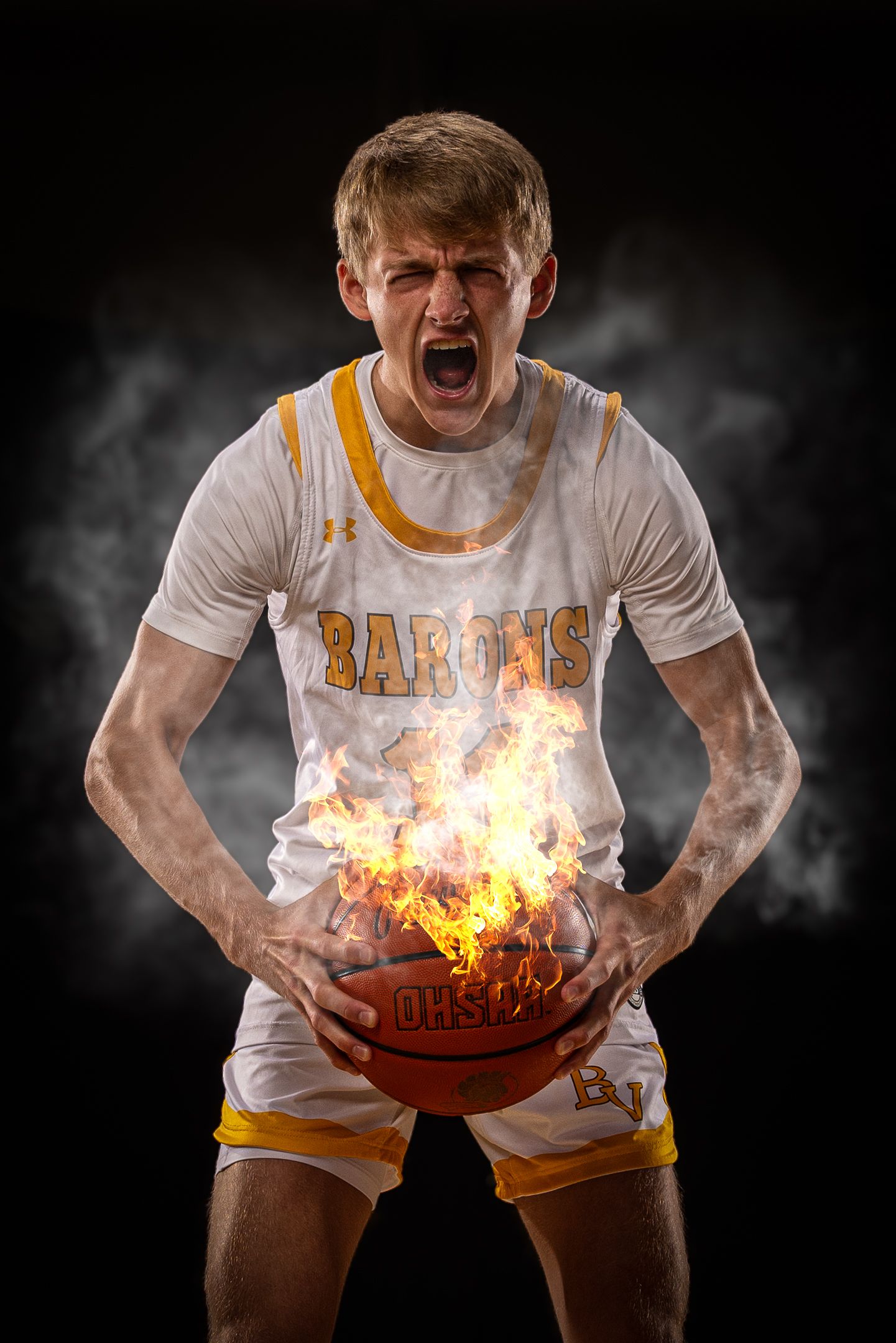 Basketball player in white jersey demonstrates intense action with flaming ball effect.