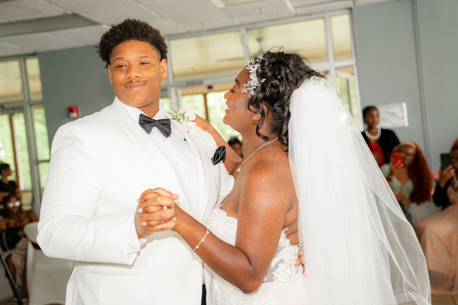 Newlyweds dancing together during their wedding celebration.