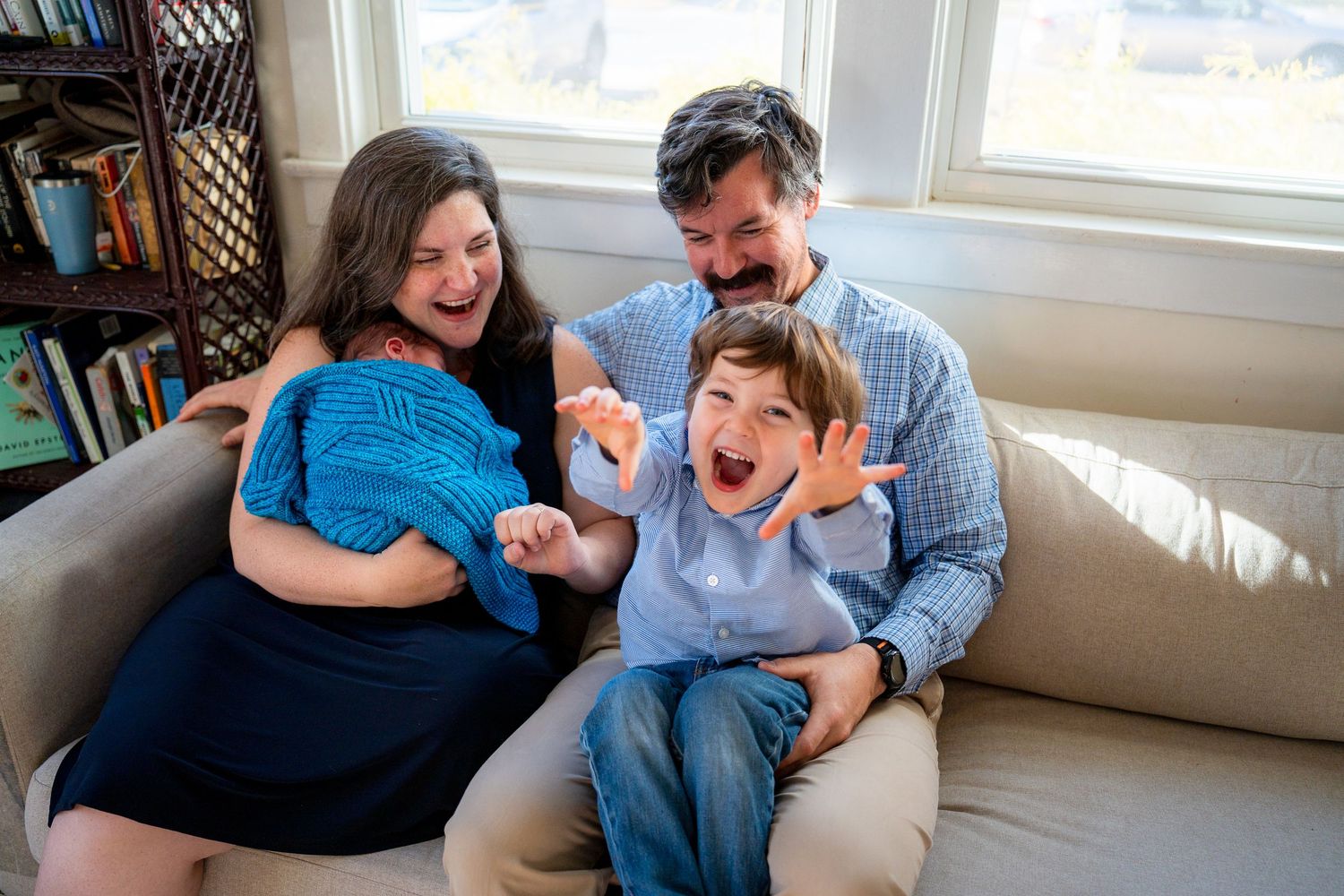 A series of candid photos show a couple laughing and playing together on a white couch in natural light.