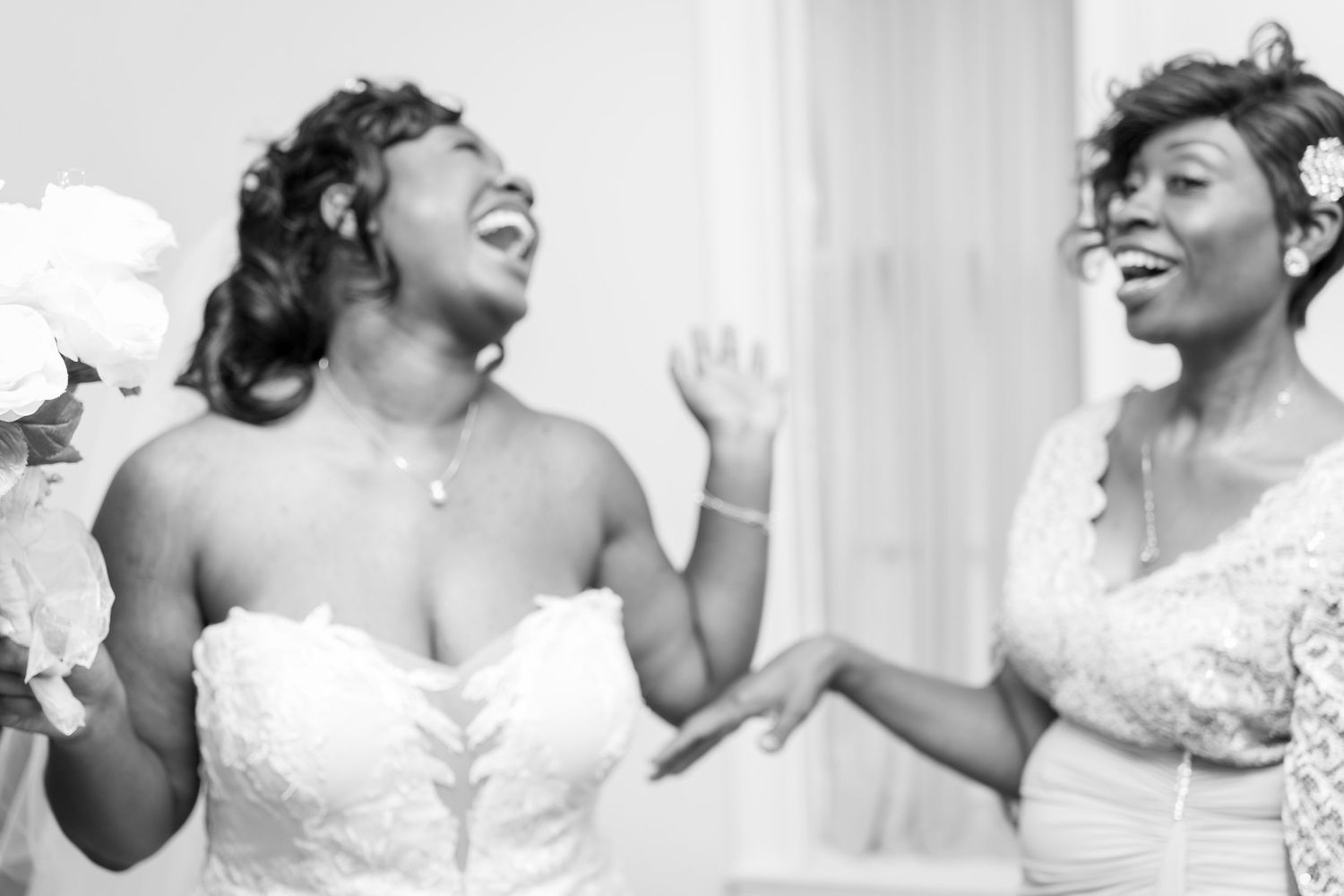 Candid moments of celebration captured in black and white photography.