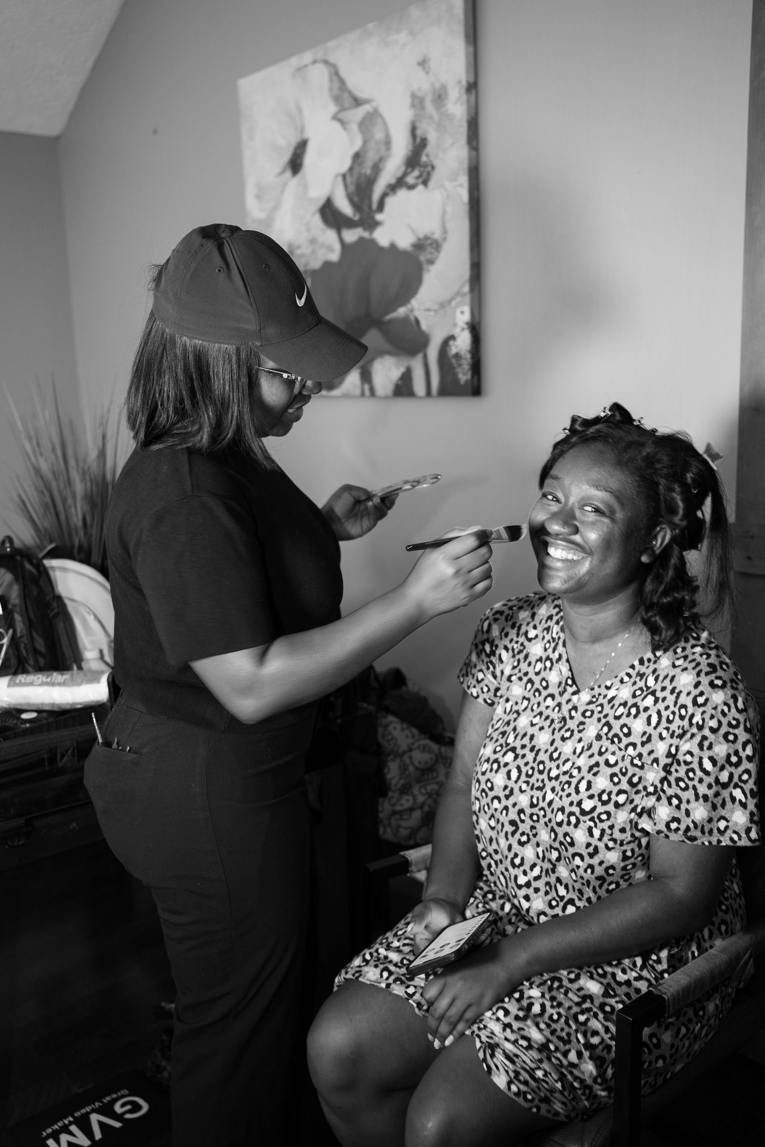 Makeup artist applying cosmetics during wedding day preparations.