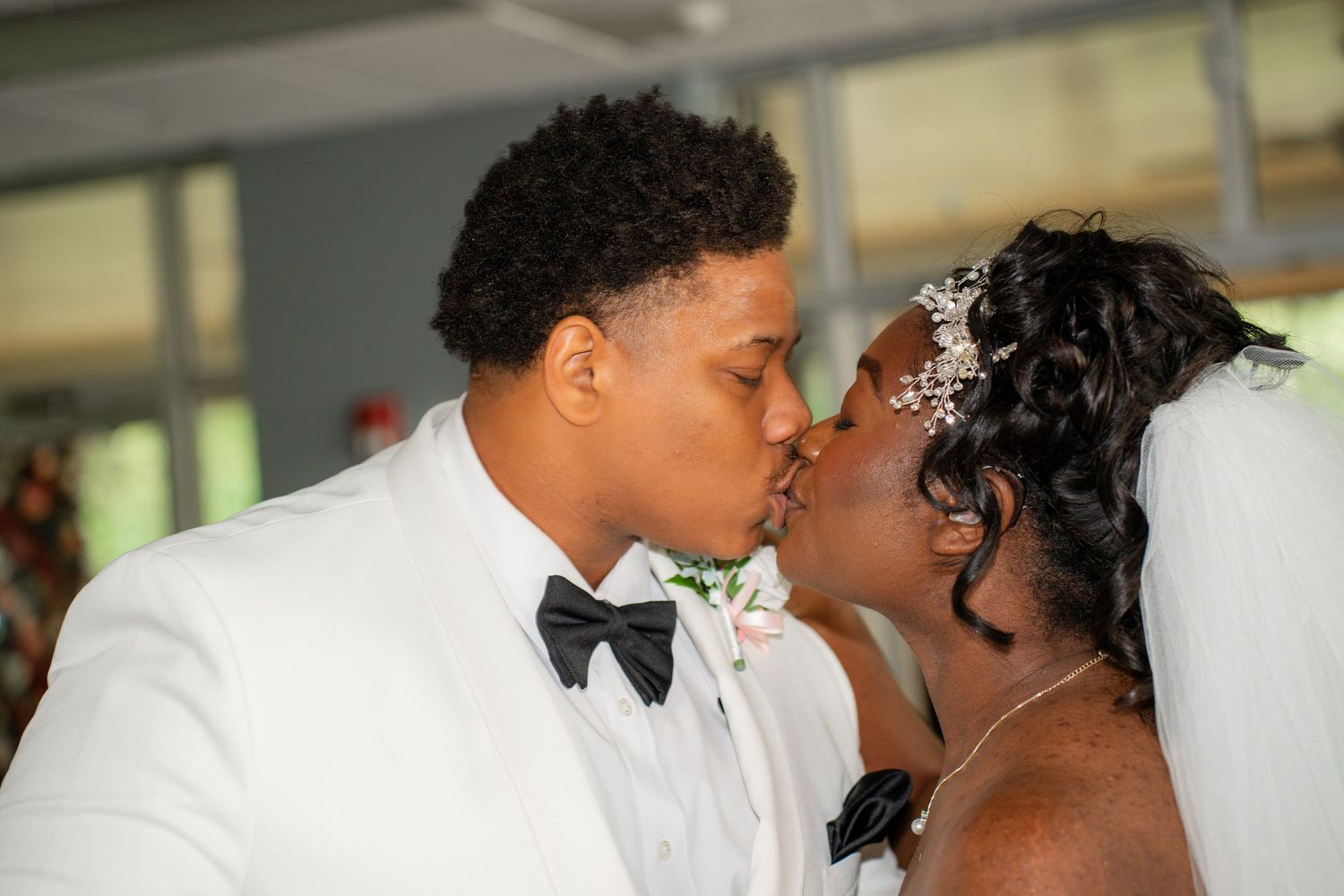 Romantic wedding couple sharing an intimate moment during their celebration.