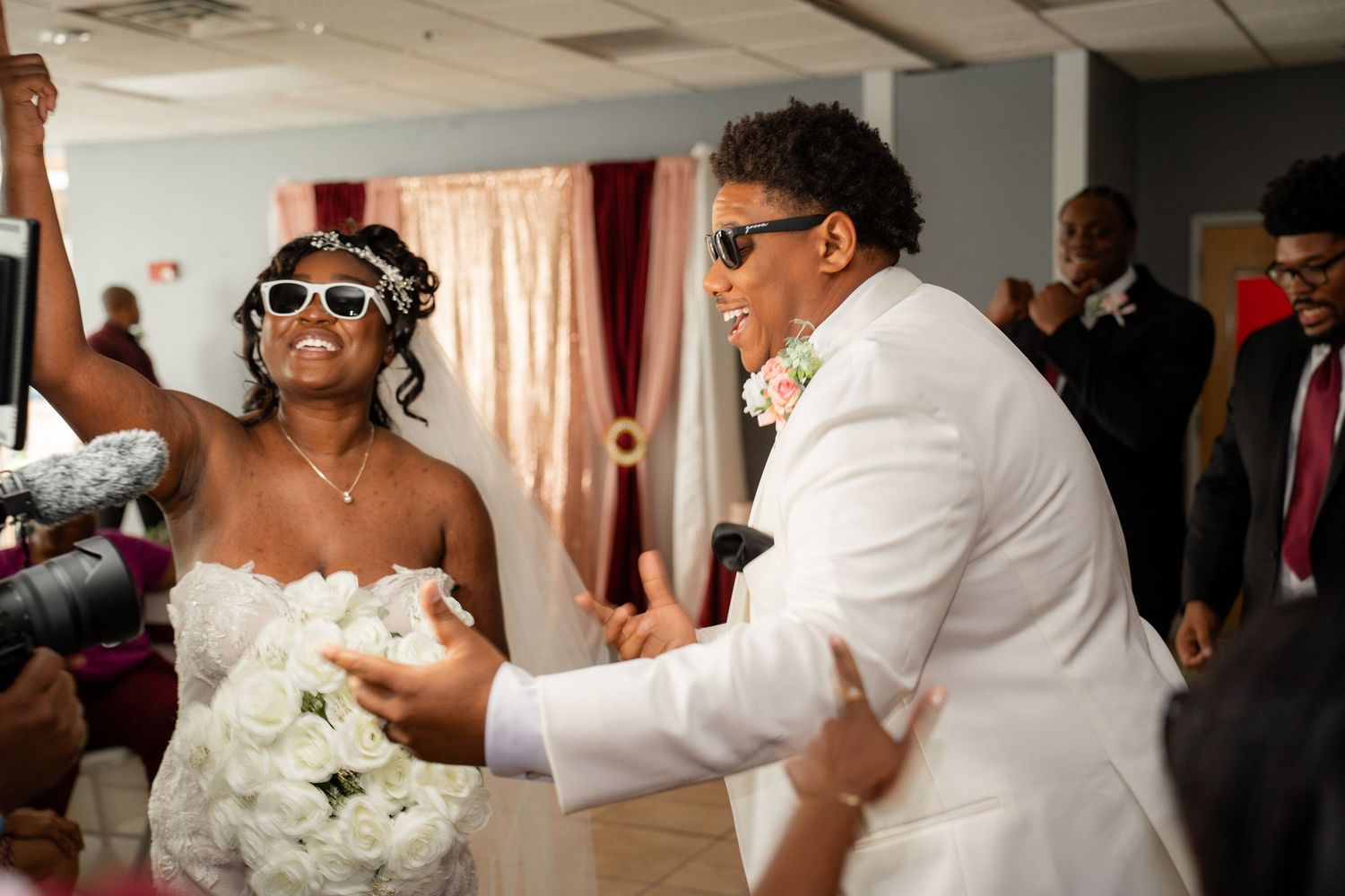 Happy couple sharing their first dance at wedding reception.