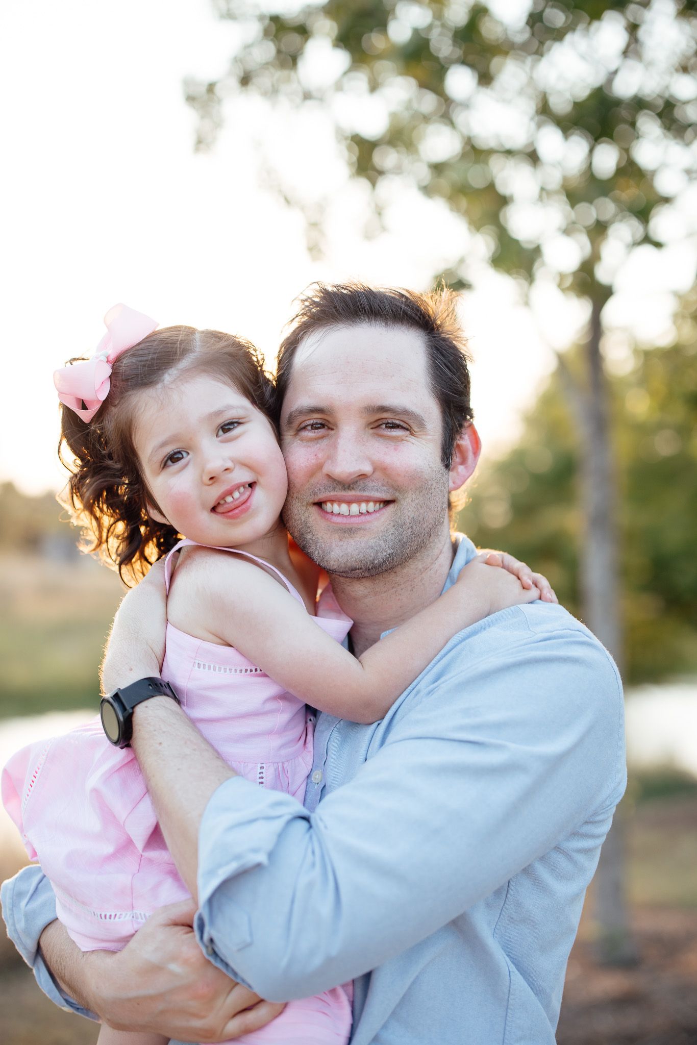Three sequential photos show a parent and child embracing outdoors with soft natural lighting at sunset.