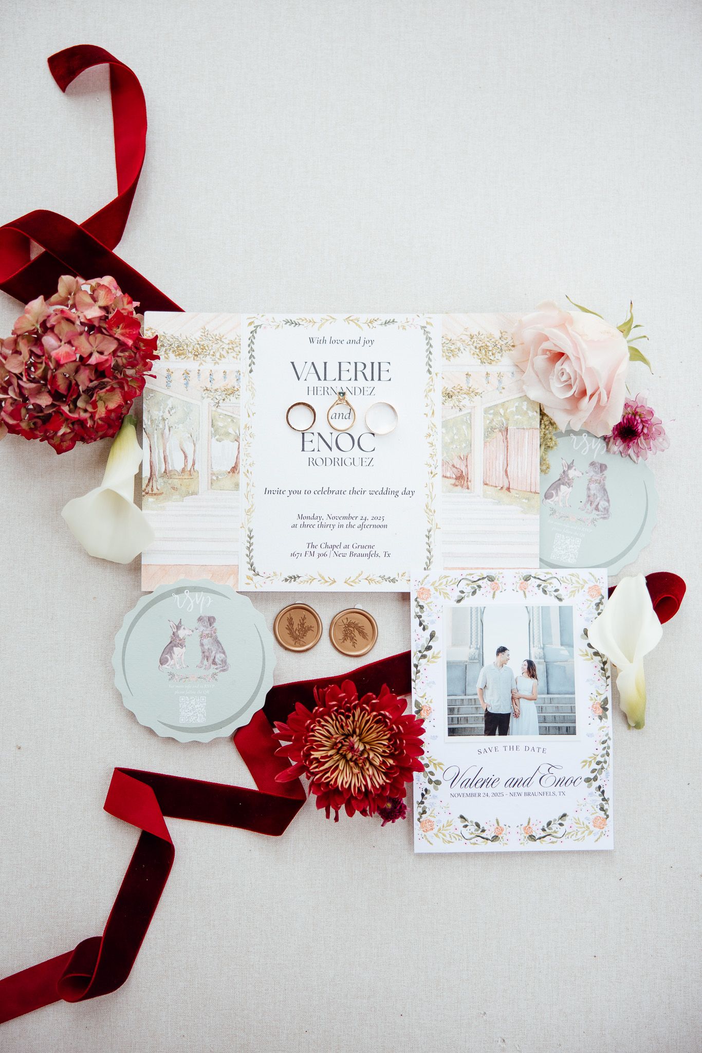 Elegant wedding invitation suite with burgundy ribbons, pink flowers, and mint accents arranged on white background.