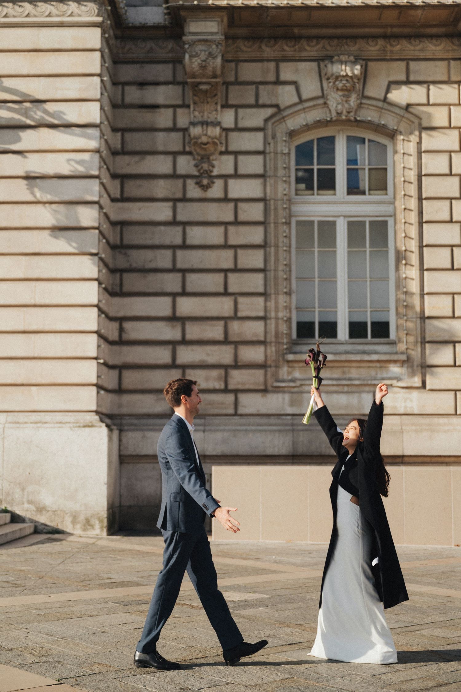 Civil wedding ceremony at Mairie de Levallois-Perret, the bride is raising her hand towards the sky