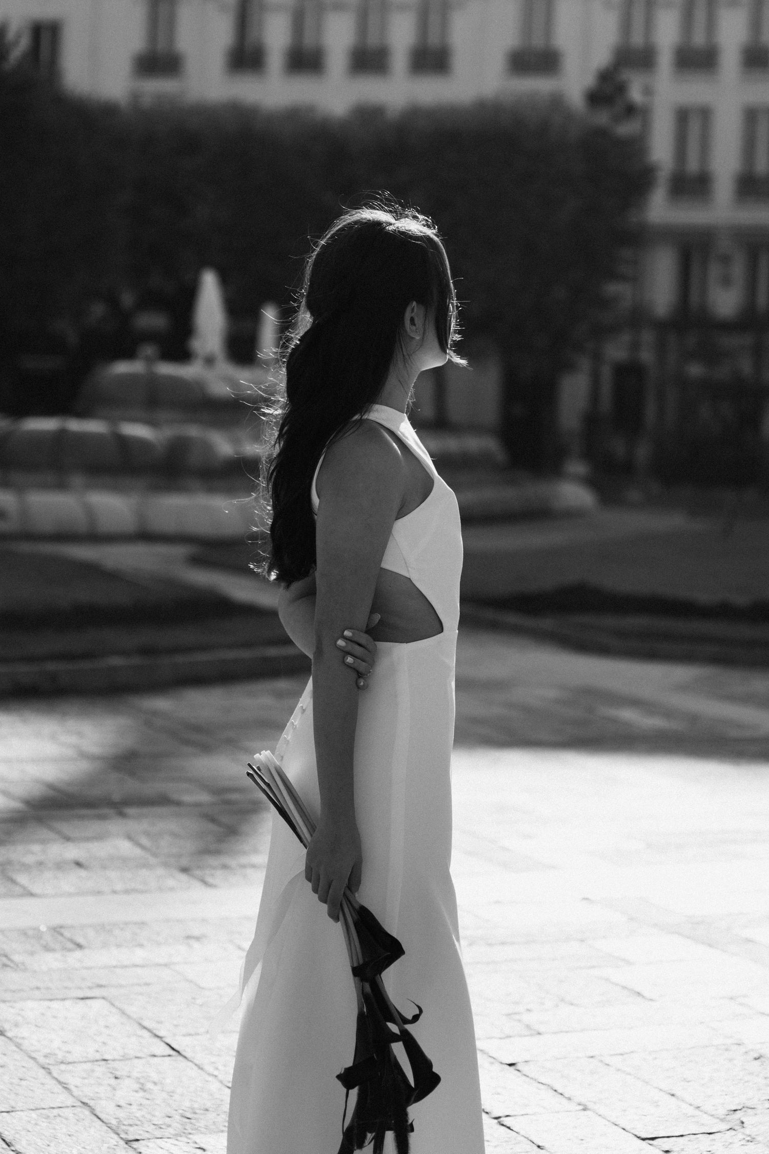 Civil wedding ceremony at Mairie de Levallois-Perret, bride waiting outside the building while holding the wedding bouquet