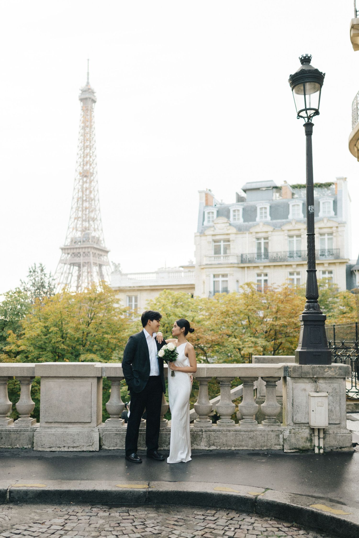 Romantic pre-wedding shoot Indonesian couple at Avenue camoens eiffel tower street