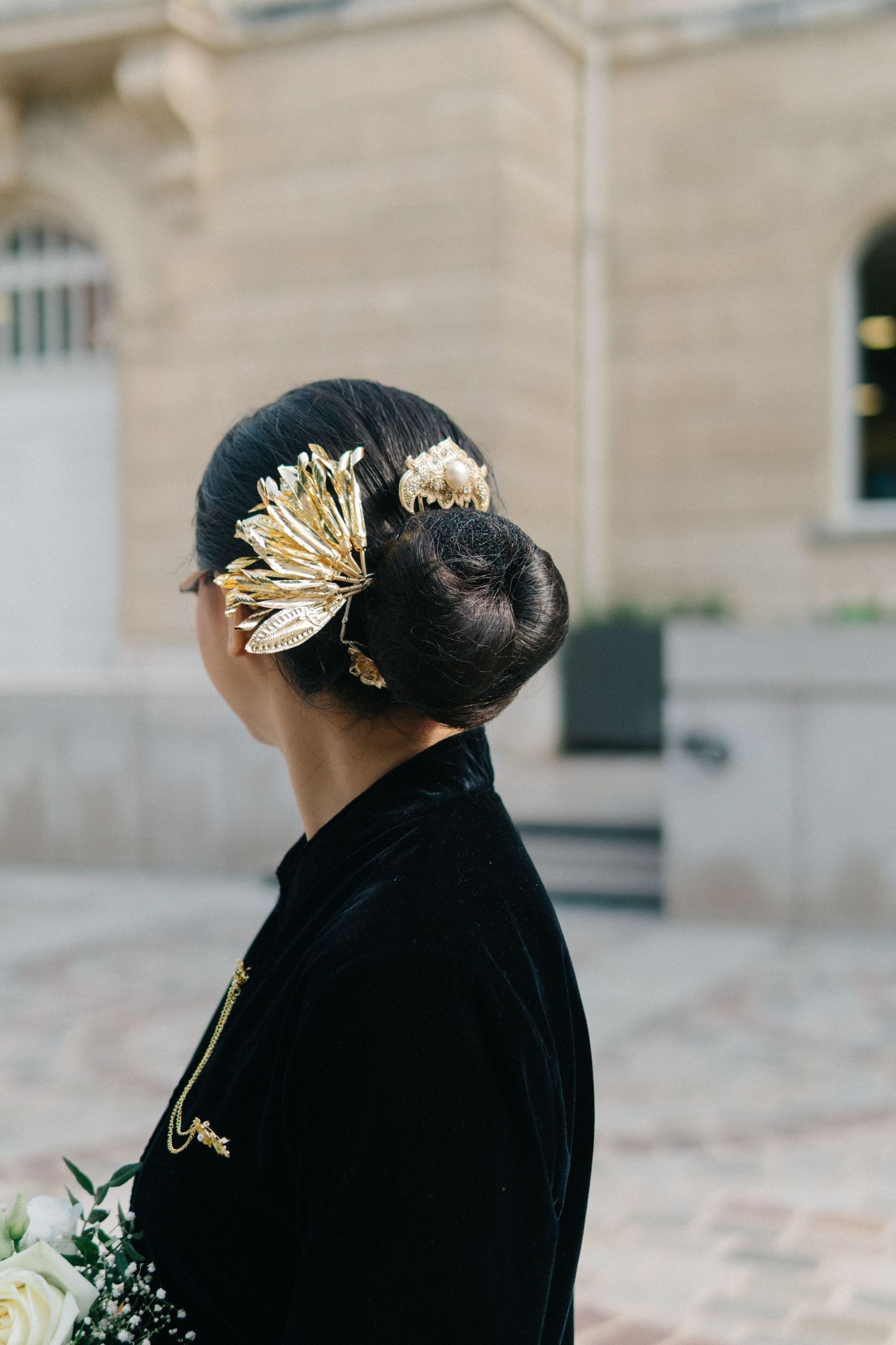 Hair detail of the bride of indonesian civil wedding in paris at mairie 14eme, wearing traditional indonesian head accessories