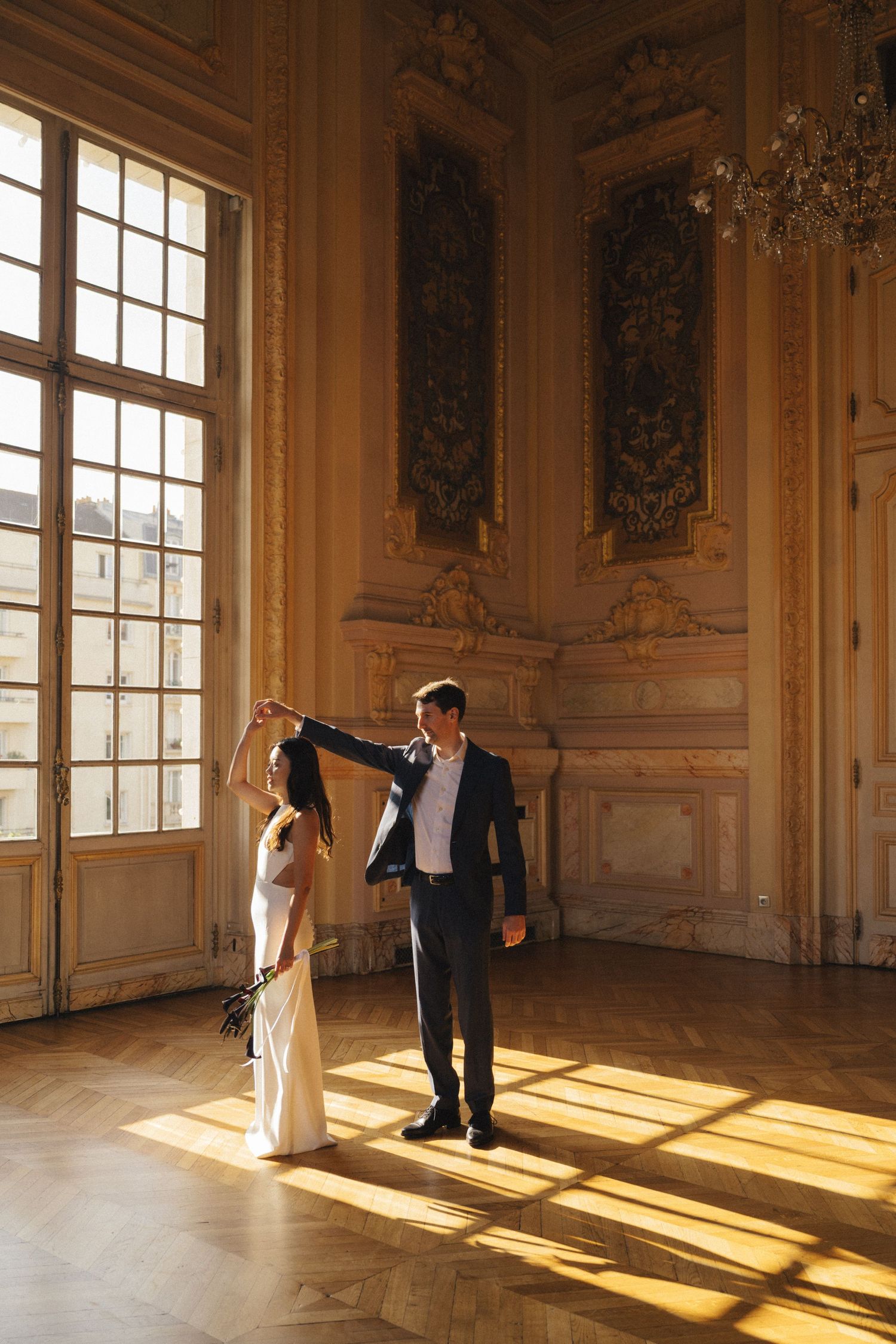 Civil wedding ceremony at Mairie de Levallois-Perret, couple dancing in the golden room