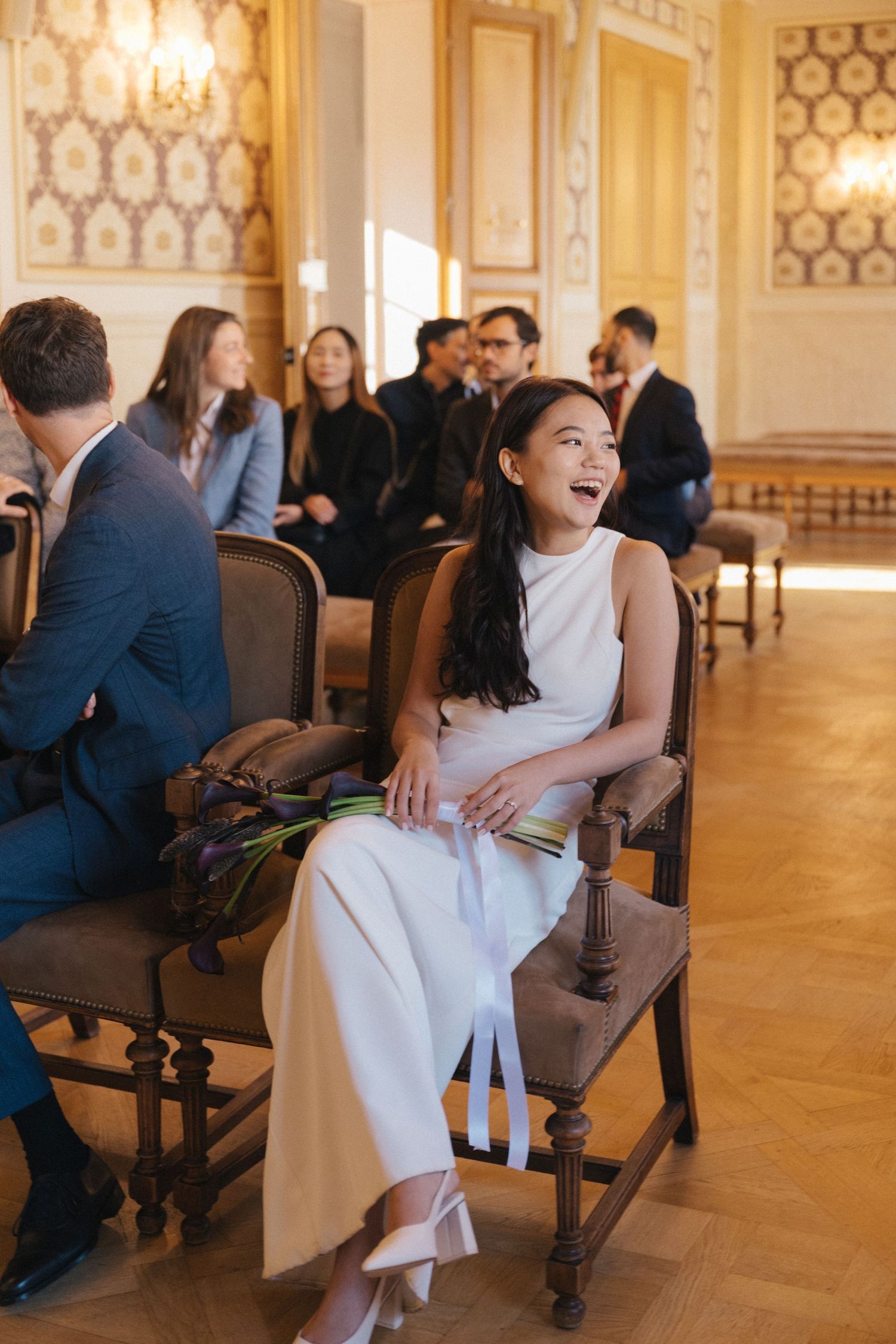 Civil wedding ceremony at Mairie de Levallois-Perret, bride laughing