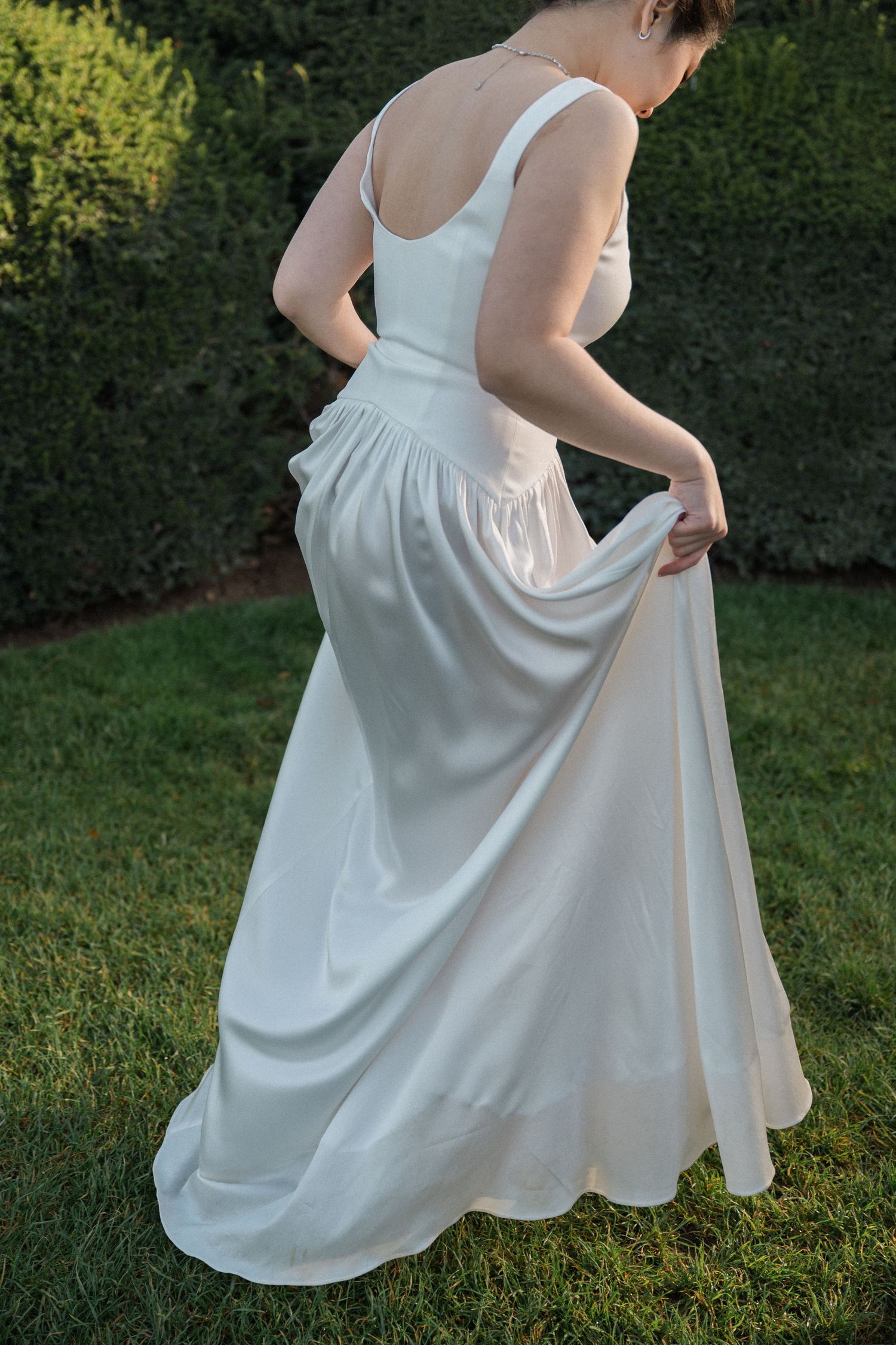 A bridal portrait at Tuileries garden, bride is lifting up her dress