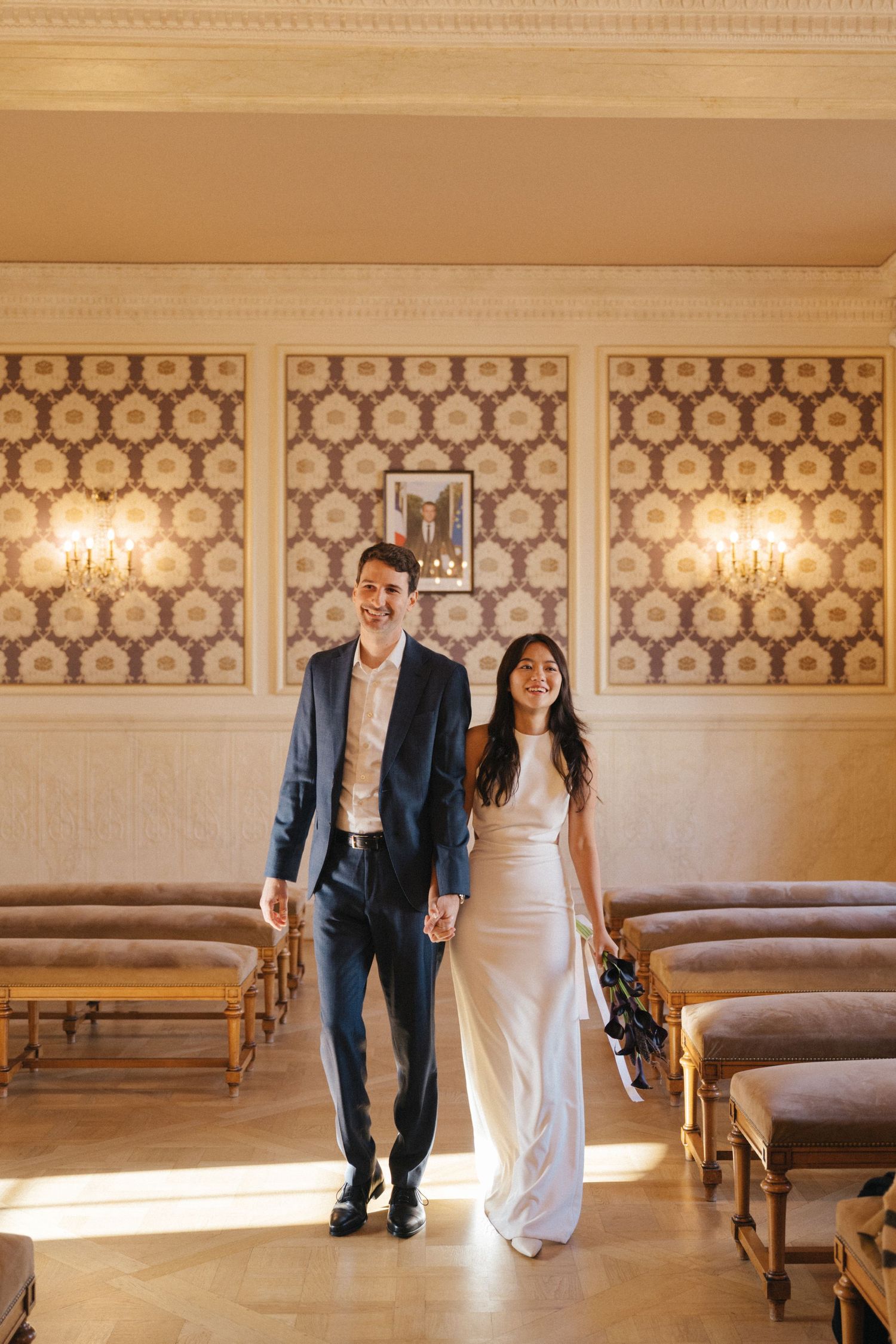 Civil wedding ceremony at Mairie de Levallois-Perret, bride and groom enters the room (wedding entrance)