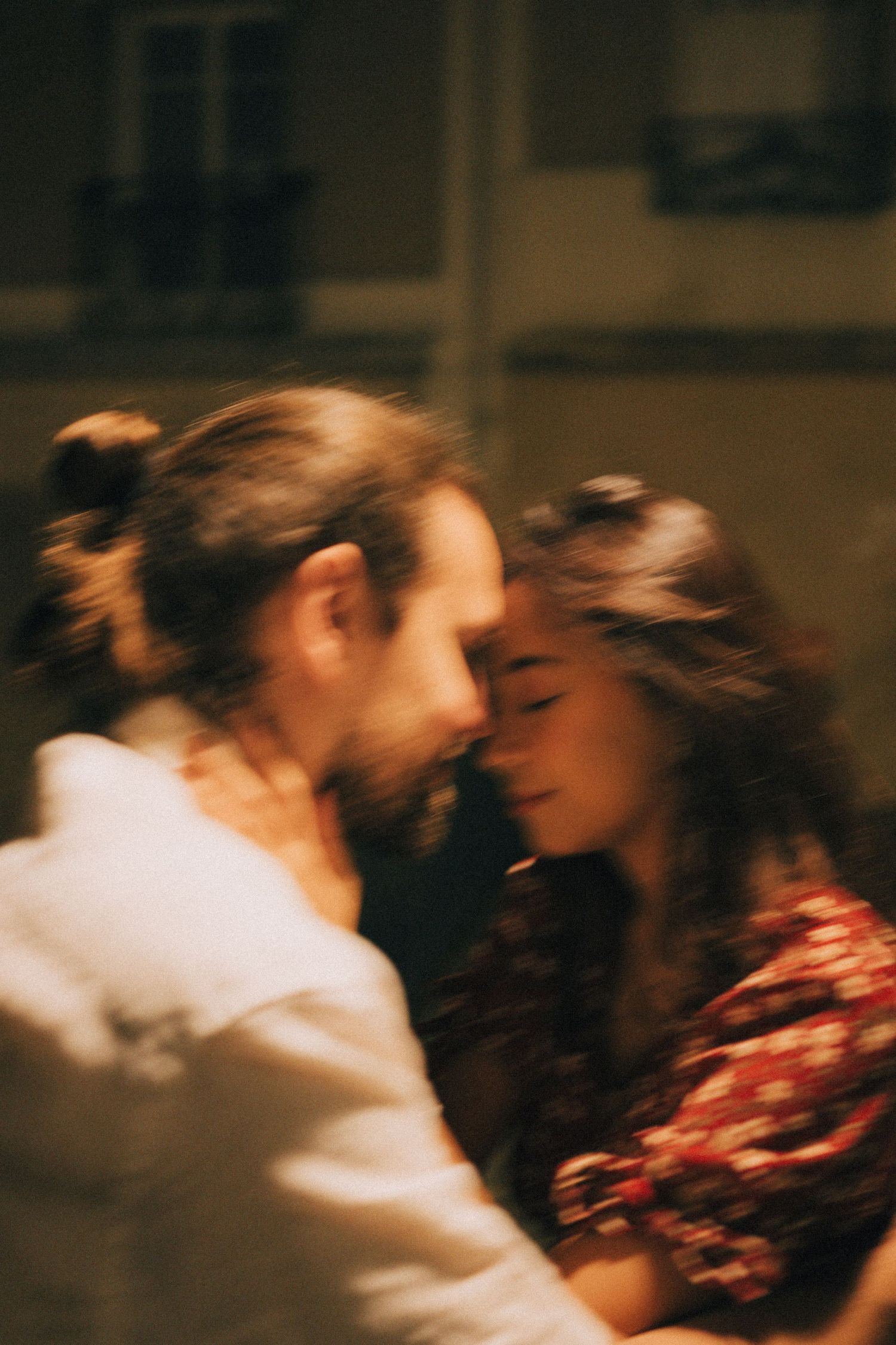 Cinematic romantic night photoshoot in montmartre paris, the couple is about to kiss