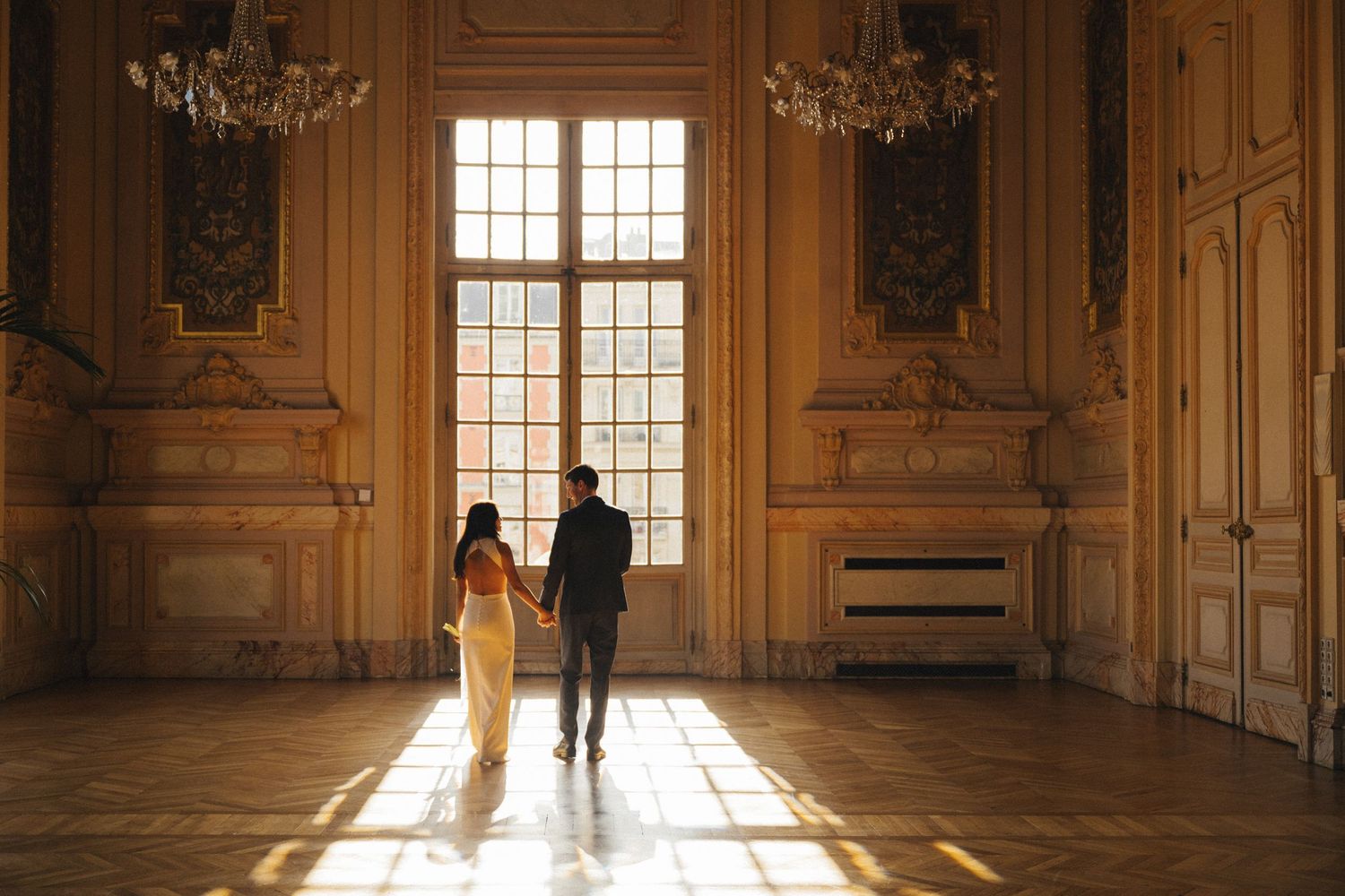 Civil wedding ceremony at Mairie de Levallois-Perret, couple walking in the golden room