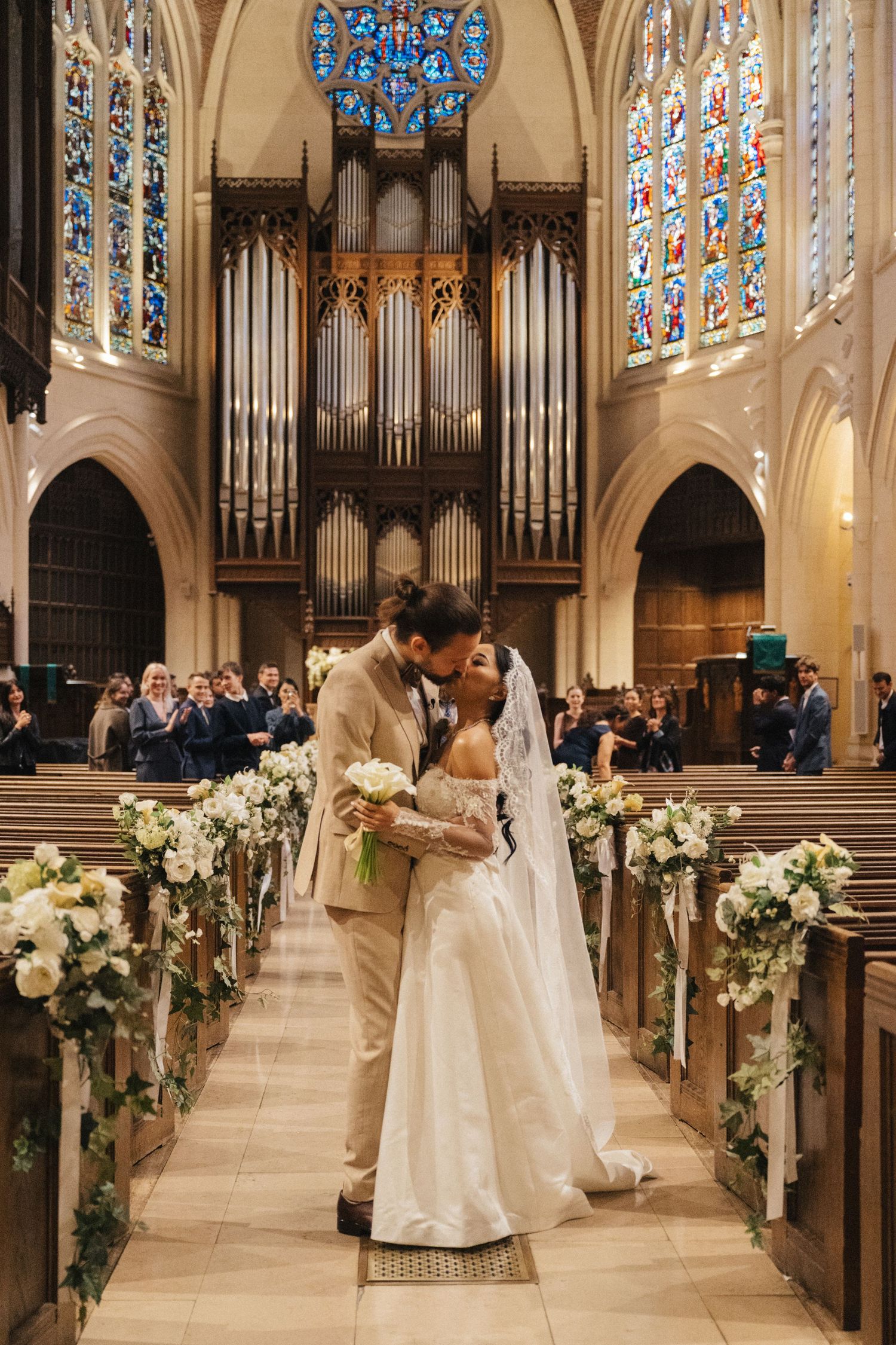 american church in paris wedding, the couple kiss