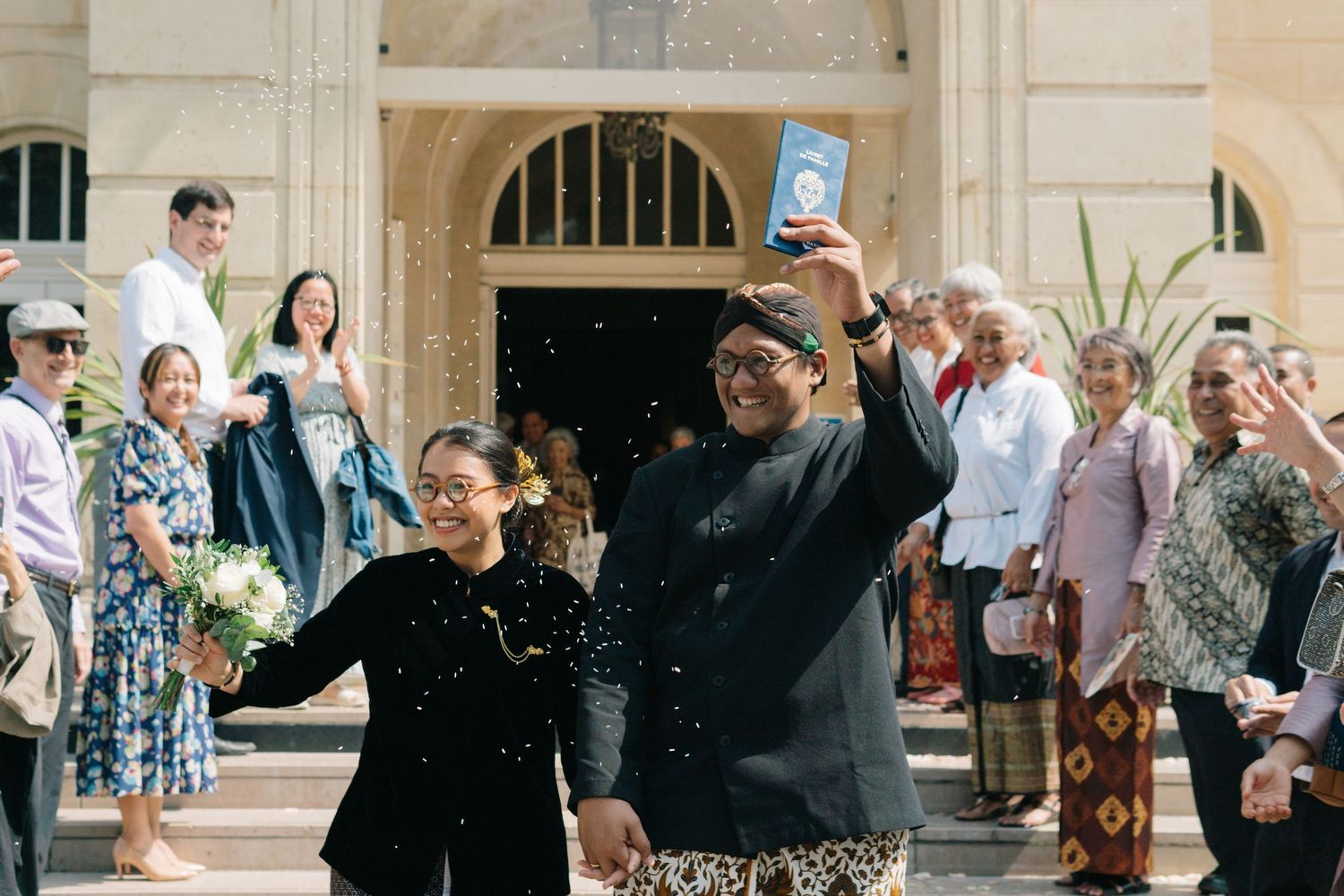 indonesian civil wedding at mairie 14eme paris photo of wedding couple exit the building