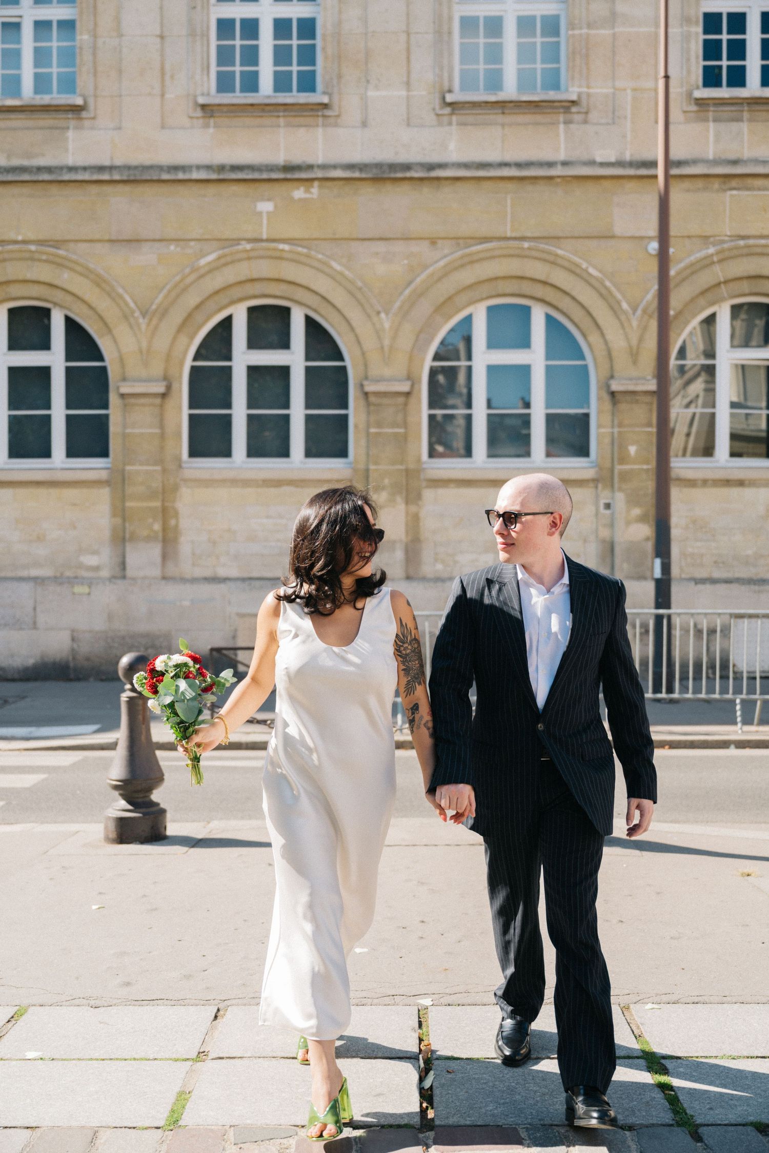 Civil wedding at mairie 14ème Paris, the bride and groom walking outside