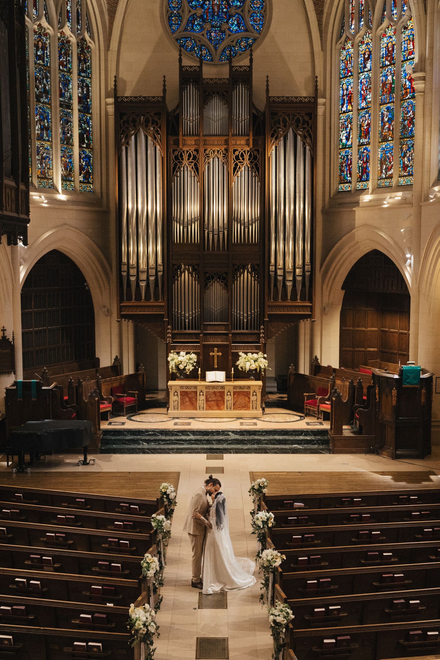 American church in paris wedding couple portrait, kissing inside the church