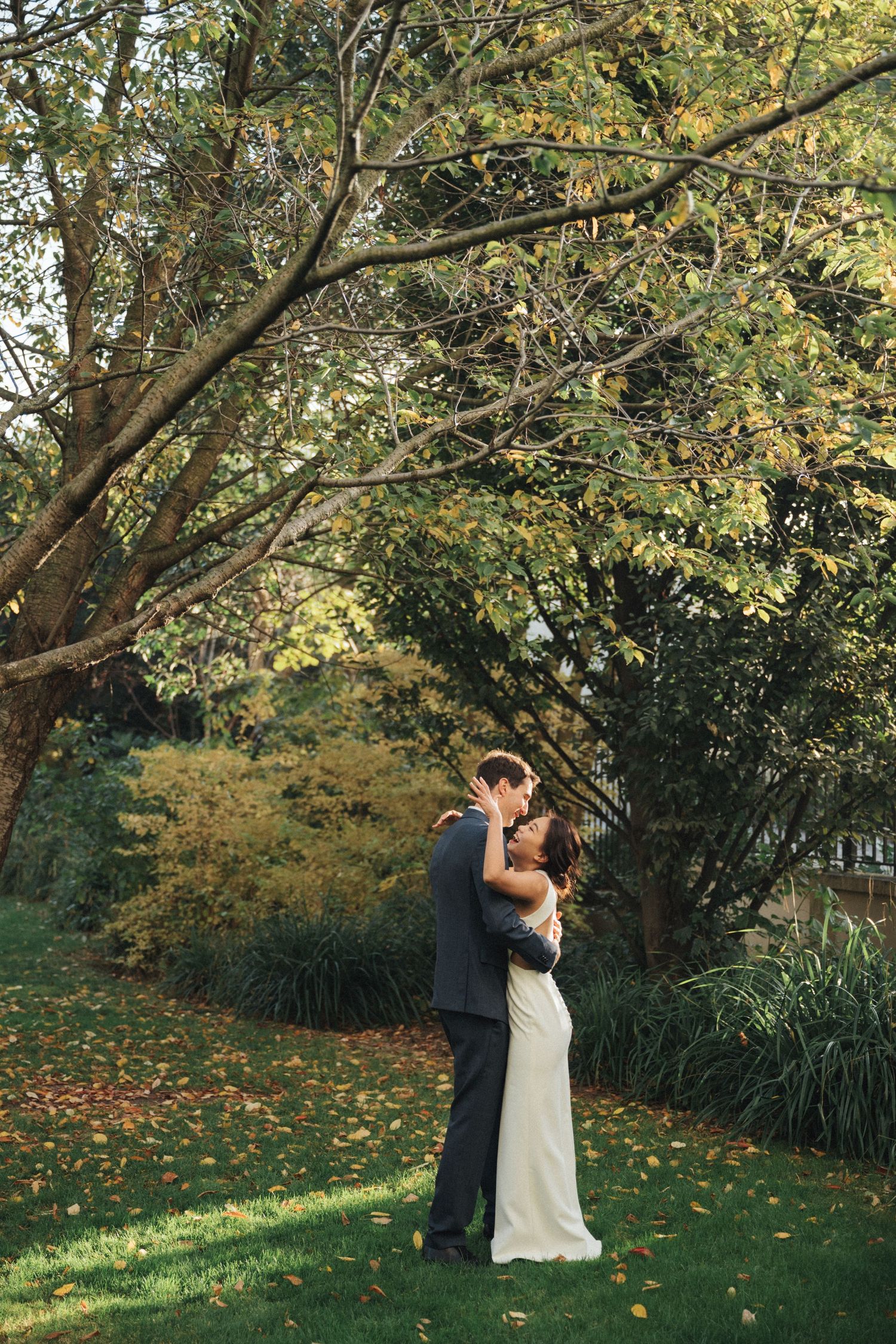Wedding couple portrait at parc de la planchette, groom and bride laughing