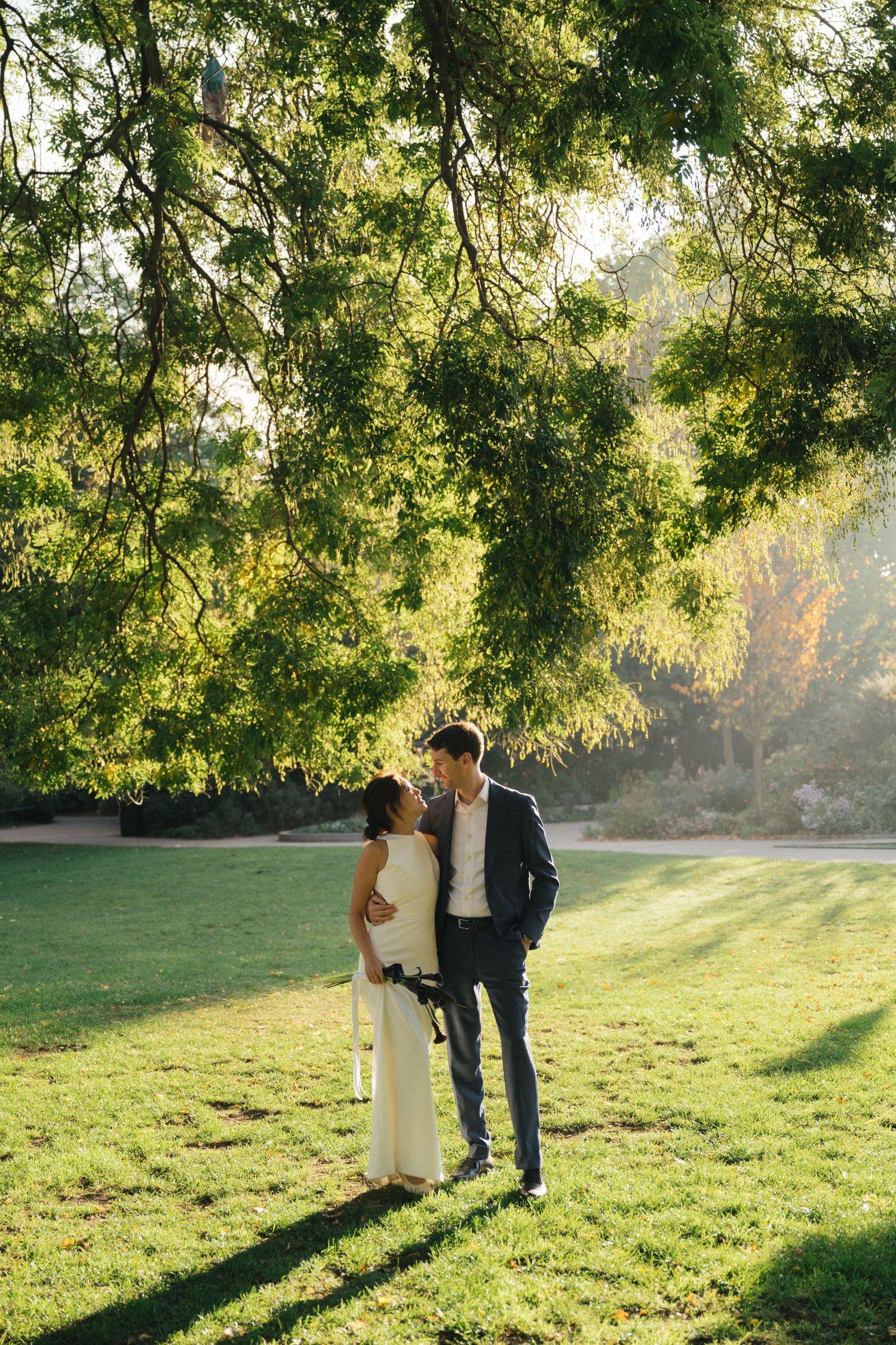 Wedding couple portrait at parc de la planchette, groom and bride looking at each other