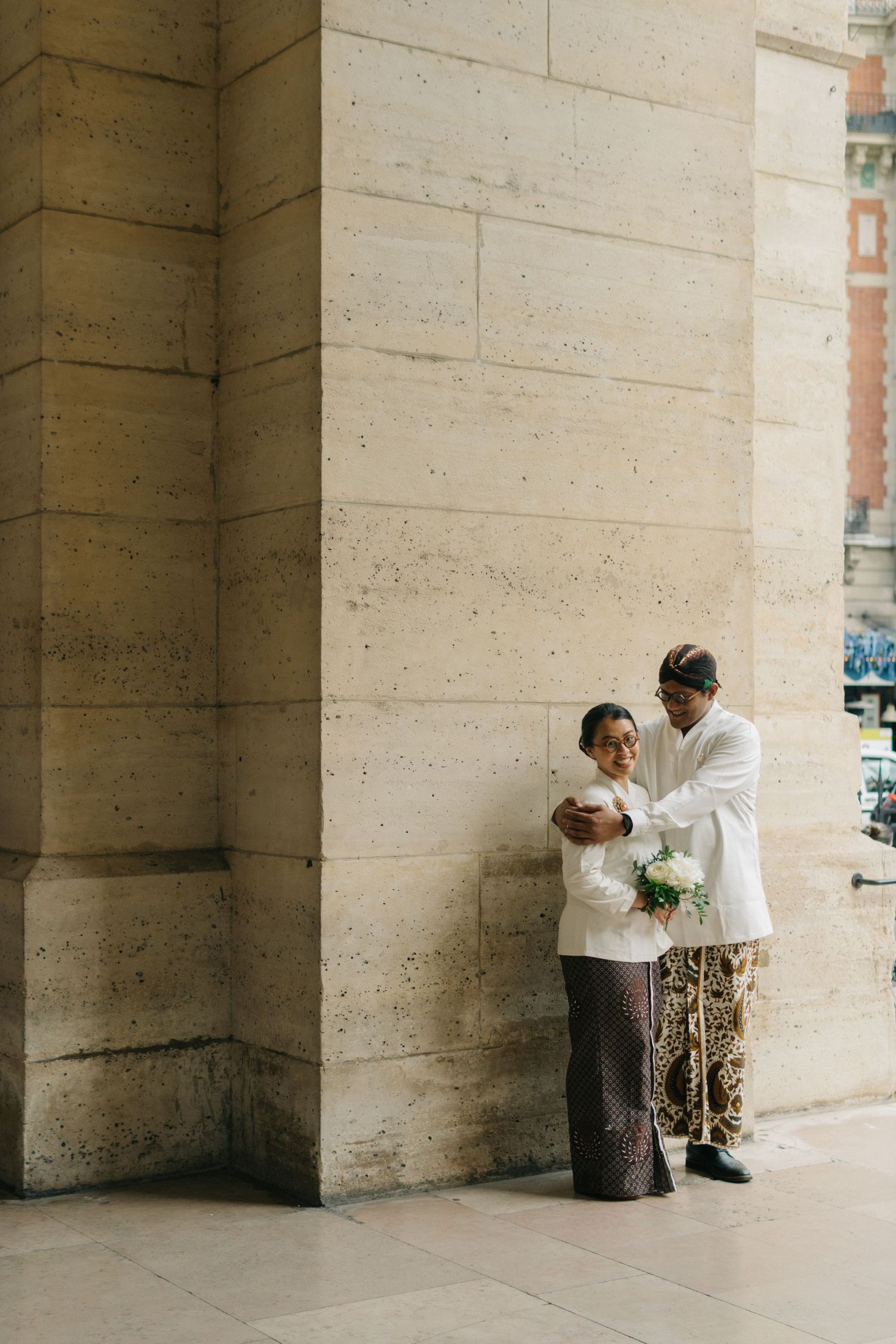 Paris church wedding of Indonesian couple wearing traditional indonesian costumes (batik) at Église Évangélique Libre de Paris Alésia
