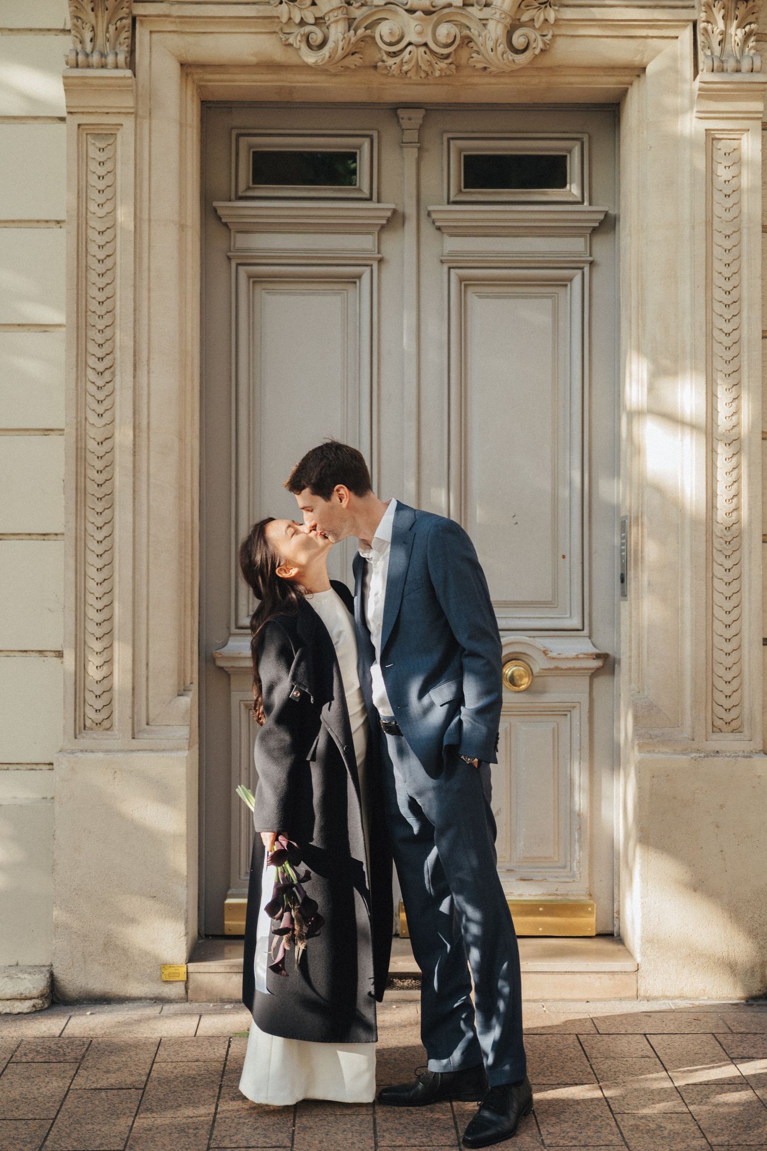 Civil wedding ceremony at Mairie de Levallois-Perret, bride and groom kissing
