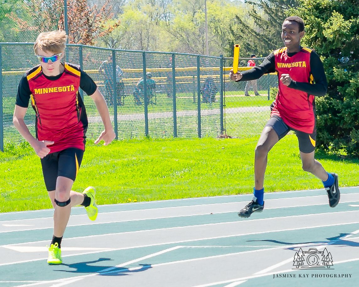 A sequence of athletic movements showing a long jump progression on a track field during practice.