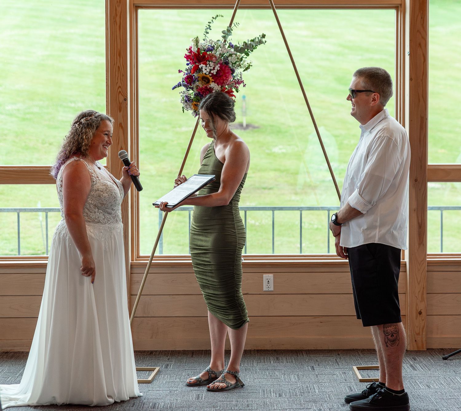 A sequence of candid wedding photos showing a couple dancing together in a sunlit room with large windows.