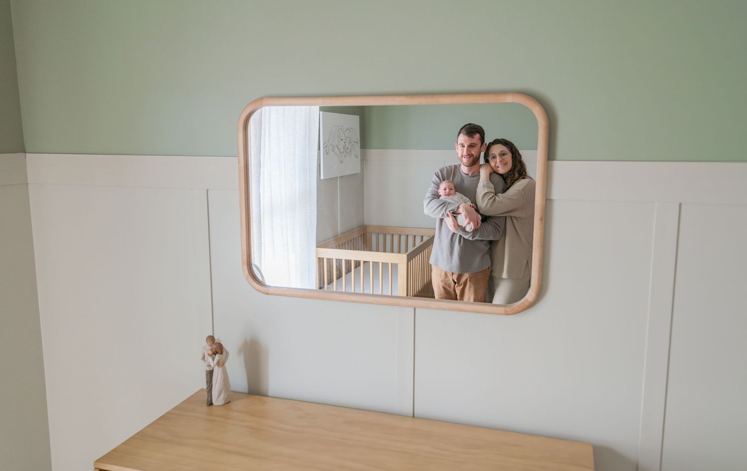 A sequence of photos showing the transformation of an empty room into a cozy nursery with mint green walls and wooden accents.
