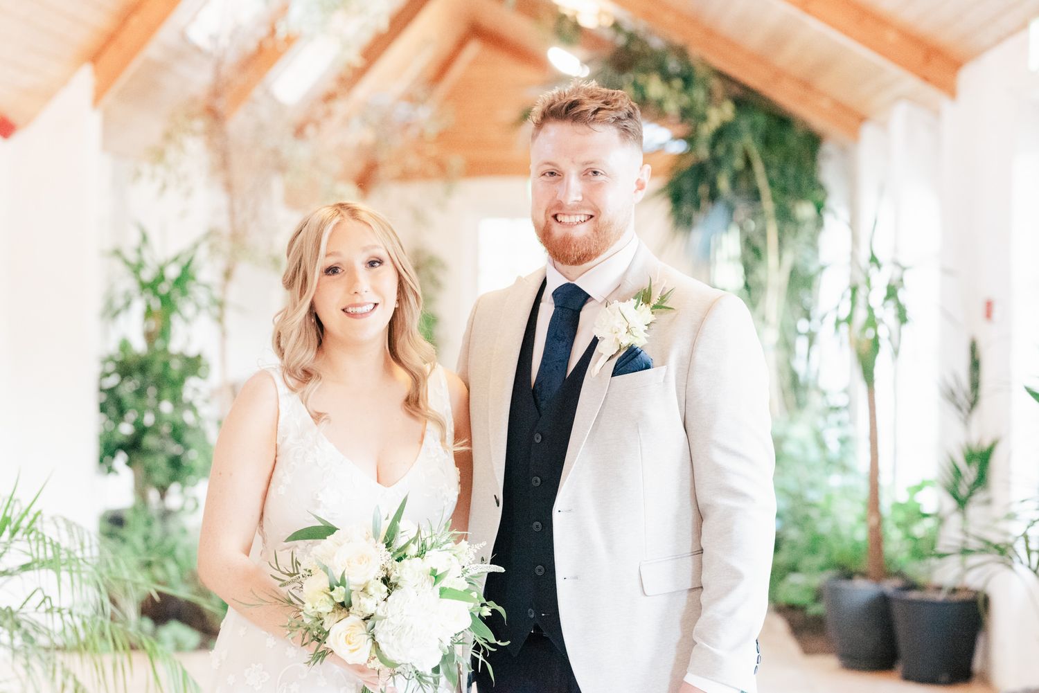A series of intimate moments captured in a sunny indoor garden setting with soft peach and white decor.