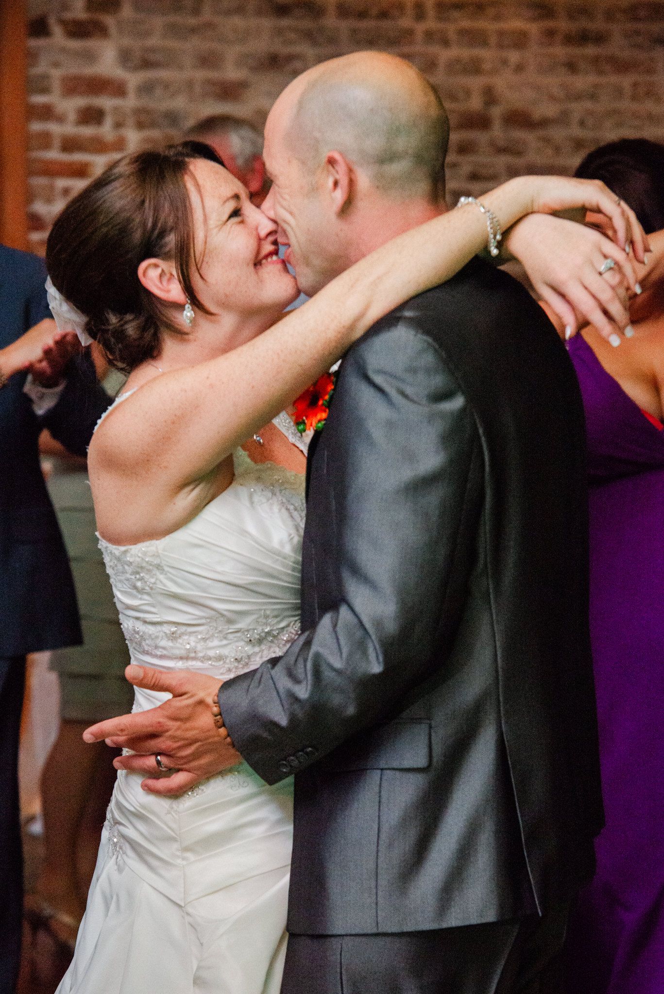 Happy newlyweds share an intimate dance moment at their wedding reception.