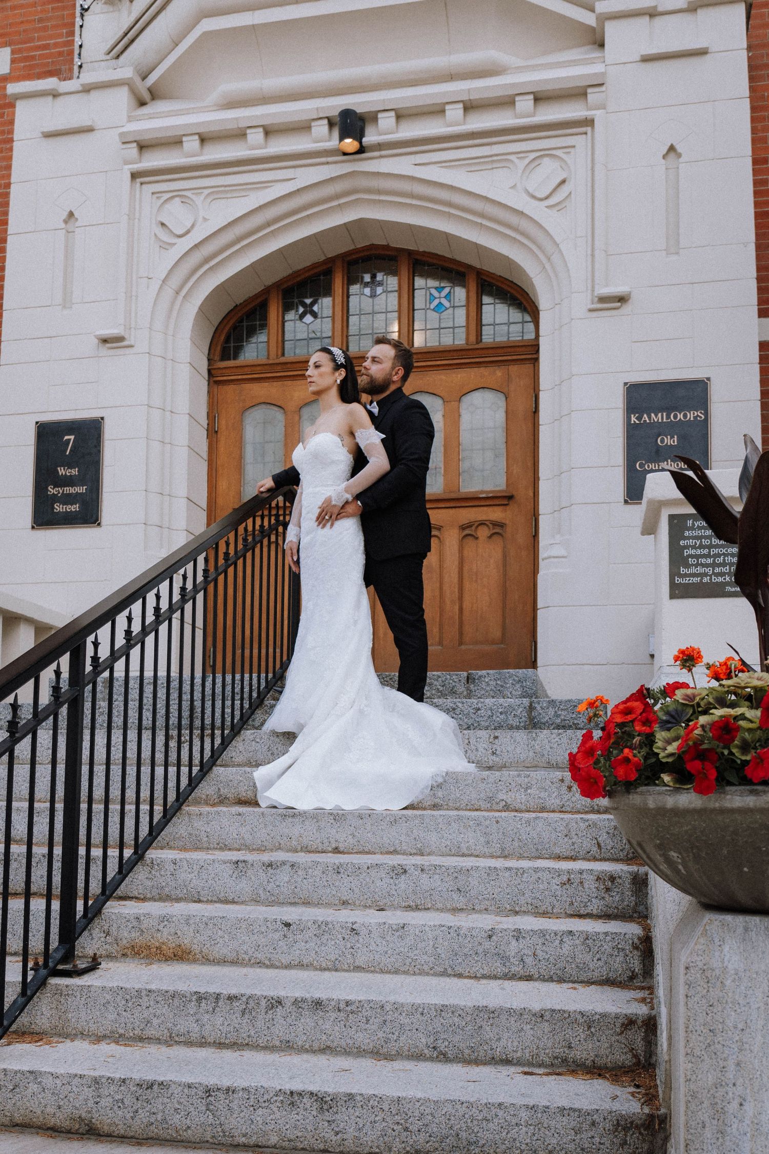 Three romantic wedding photos showing a couple in formal attire posing on stone steps of a historic building entrance.