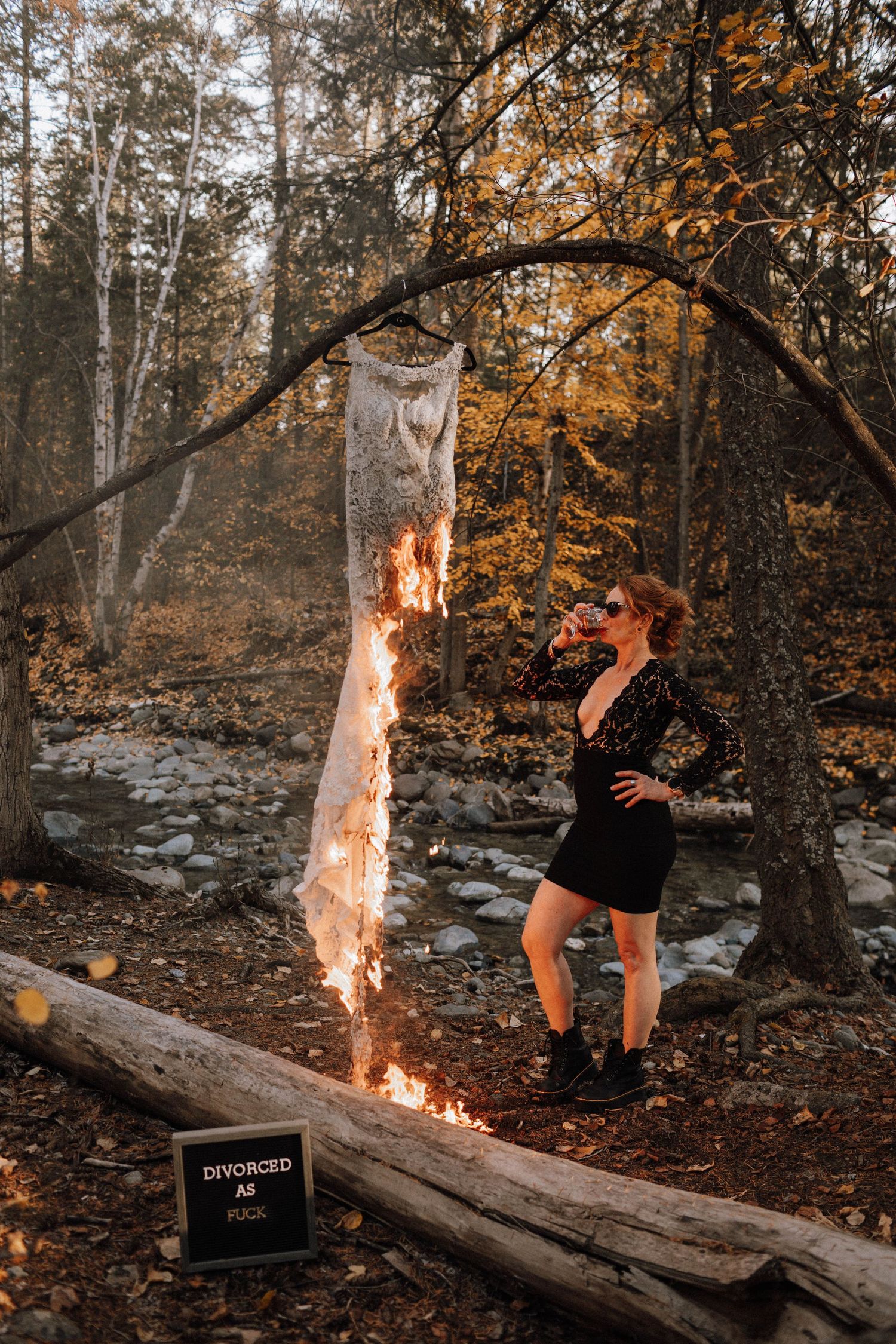 A sequence of photos showing a person jumping over a flaming log in a forest during autumn.