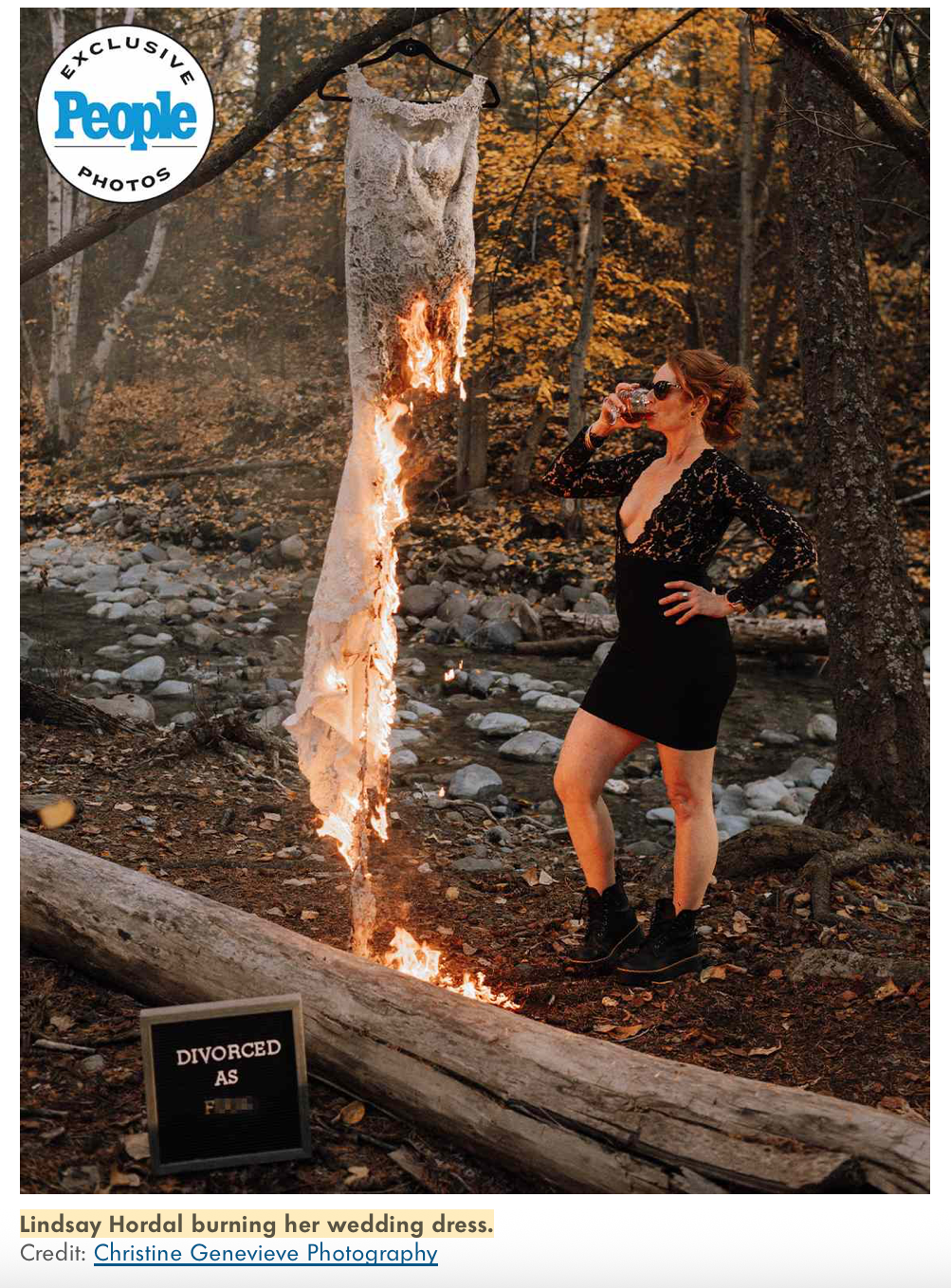 A person sets fire to a wedding dress outdoors in a dramatic photo shoot among autumn trees.