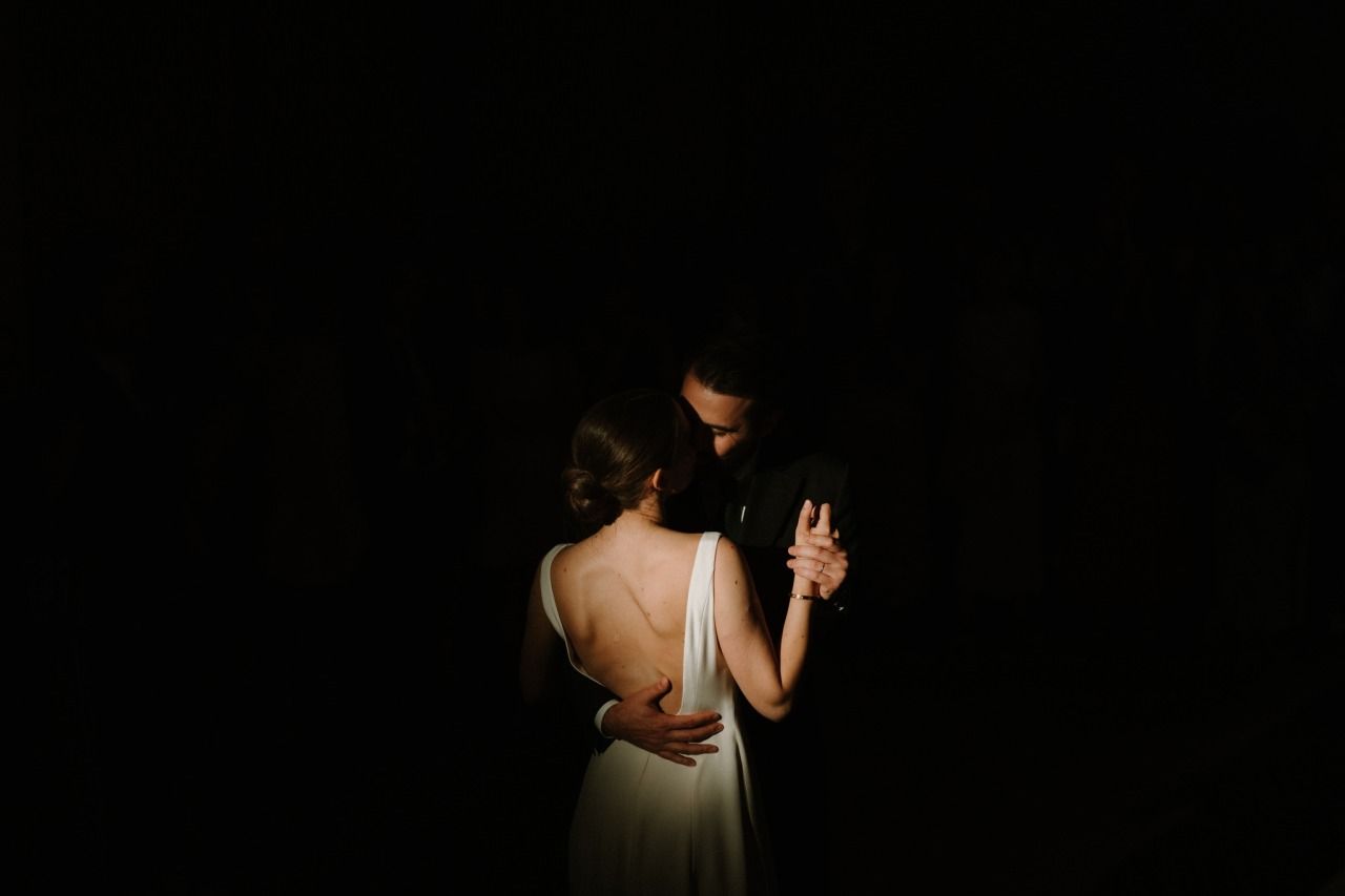 Dramatic low-light artistic wedding photography shots with silhouettes.